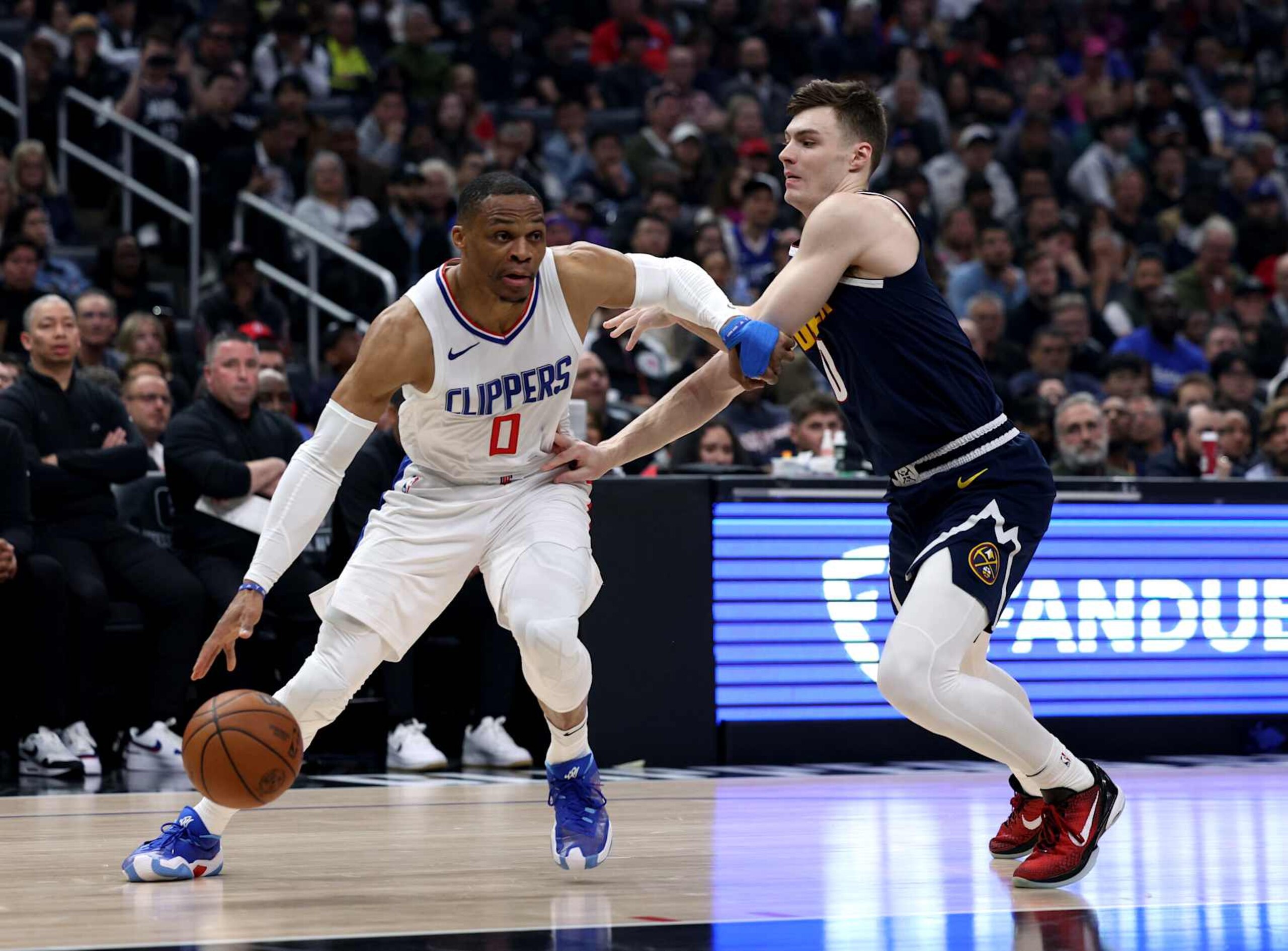 LOS ANGELES, CALIFORNIA - APRIL 04: Russell Westbrook #0 of the LA Clippers drives to the basket on Christian Braun #0 of the Denver Nuggets during the first half at Crypto.com Arena on April 04, 2024 in Los Angeles, California. User is consenting to the terms and conditions of the Getty Images License Agreement. (Photo by Harry How/Getty Images) LOS ANGELES, CALIFORNIA - APRIL 04: Russell Westbrook #0 of the LA Clippers drives to the basket on Christian Braun #0 of the Denver Nuggets during the first half at Crypto.com Arena on April 04, 2024 in Los Angeles, California. User is consenting to the terms and conditions of the Getty Images License Agreement. (Photo by Harry How/Getty Images)