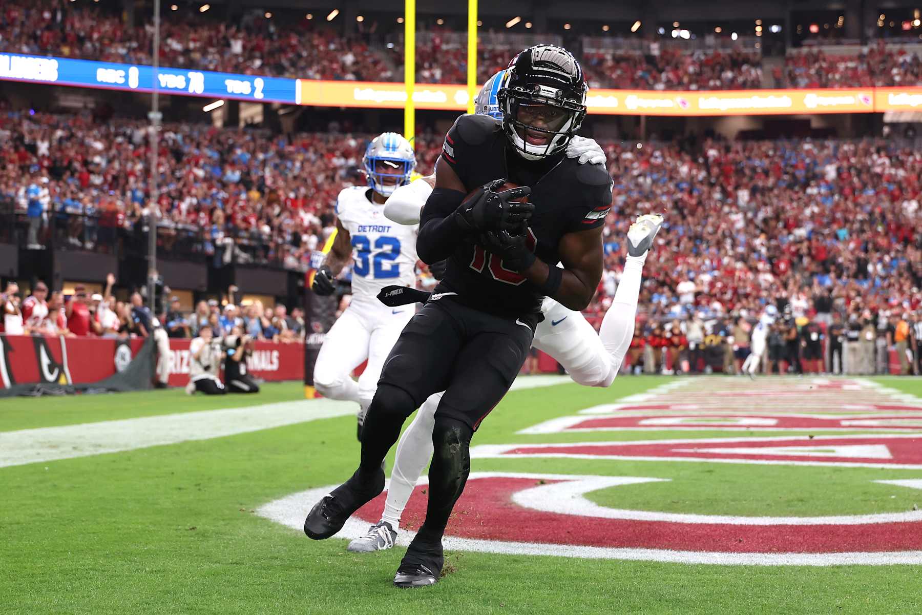 GLENDALE, ARIZONA - SEPTEMBER 22: Marvin Harrison Jr. #18 of the Arizona Cardinals scores a touchdown against the Detroit Lions during the first quarter at State Farm Stadium on September 22, 2024 in Glendale, Arizona. (Photo by Christian Petersen/Getty Images)