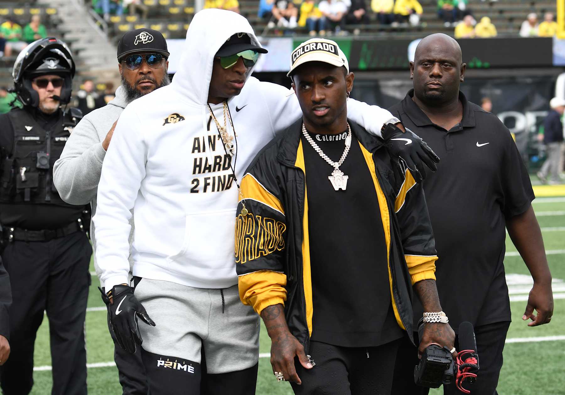 EUGENE, OR - SEPTEMBER 23: Colorado Buffaloes head coach Deion Sanders talks with his son Deion Jr. on the field during a PAC-12 conference football game between the Colorado Buffaloes and Oregon Ducks on September 23, 2023 at Autzen Stadium in Eugene, Oregon. (Photo by Brian Murphy/Icon Sportswire via Getty Images)