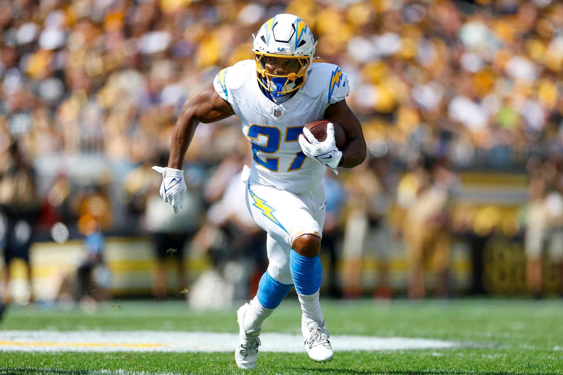 PITTSBURGH, PENNSYLVANIA - SEPTEMBER 22: J.K. Dobbins #27 of the Los Angeles Chargers runs with the ball in the first quarter during a game against the Pittsburgh Steelers at Acrisure Stadium on September 22, 2024 in Pittsburgh, Pennsylvania. (Photo by Brandon Sloter/Getty Images)