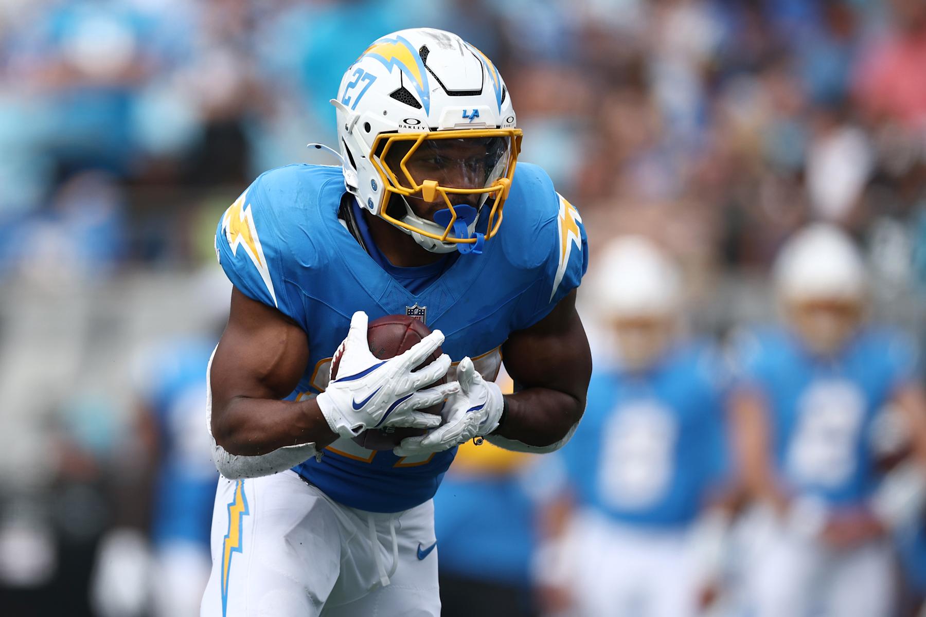 CHARLOTTE, NORTH CAROLINA - SEPTEMBER 15: Running back J.K. Dobbins #27 of the Los Angeles Chargers carries the ball during the second half of the game against the Carolina Panthers at Bank of America Stadium on September 15, 2024 in Charlotte, North Carolina. (Photo by Jared C. Tilton/Getty Images)