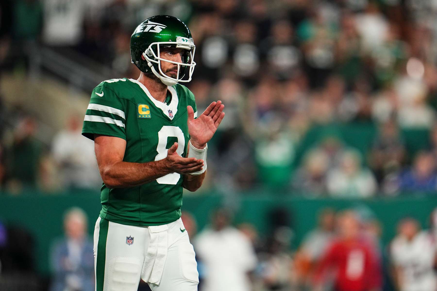 EAST RUTHERFORD, NJ - SEPTEMBER 19: Aaron Rodgers #8 of the New York Jets celebrates during an NFL football game against the New England Patriots at MetLife Stadium on September 19, 2024 in East Rutherford, New Jersey. (Photo by Cooper Neill/Getty Images)