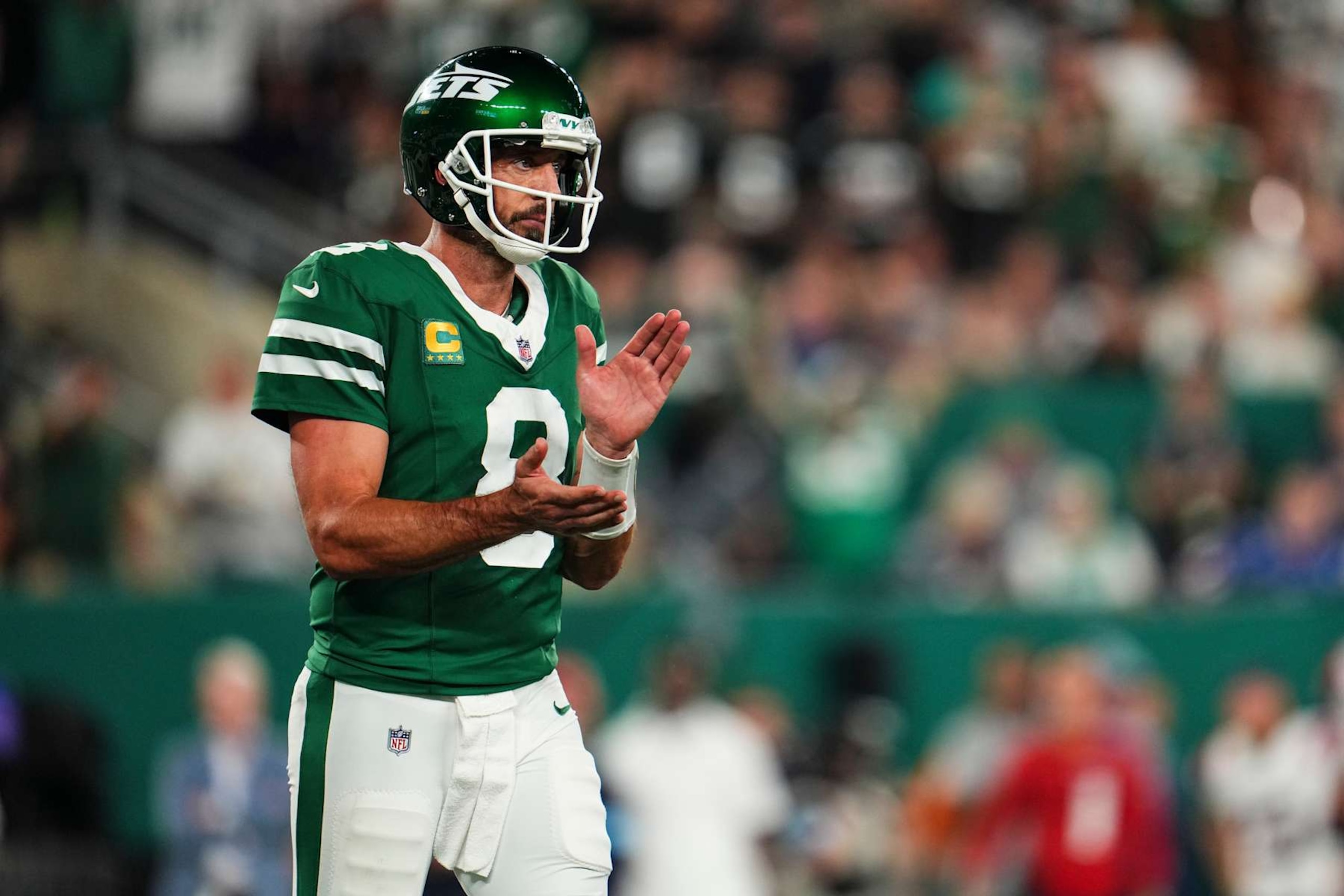 EAST RUTHERFORD, NJ - SEPTEMBER 19: Aaron Rodgers #8 of the New York Jets celebrates during an NFL football game against the New England Patriots at MetLife Stadium on September 19, 2024 in East Rutherford, New Jersey. (Photo by Cooper Neill/Getty Images)