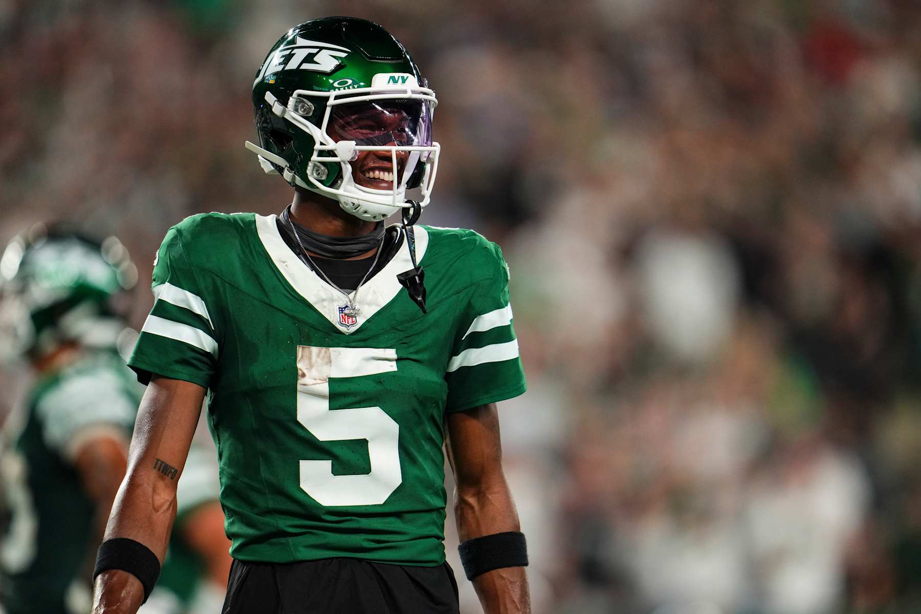 EAST RUTHERFORD, NJ - SEPTEMBER 19: Garrett Wilson #5 of the New York Jets celebrates during an NFL football game against the New England Patriots at MetLife Stadium on September 19, 2024 in East Rutherford, New Jersey. (Photo by Cooper Neill/Getty Images)
