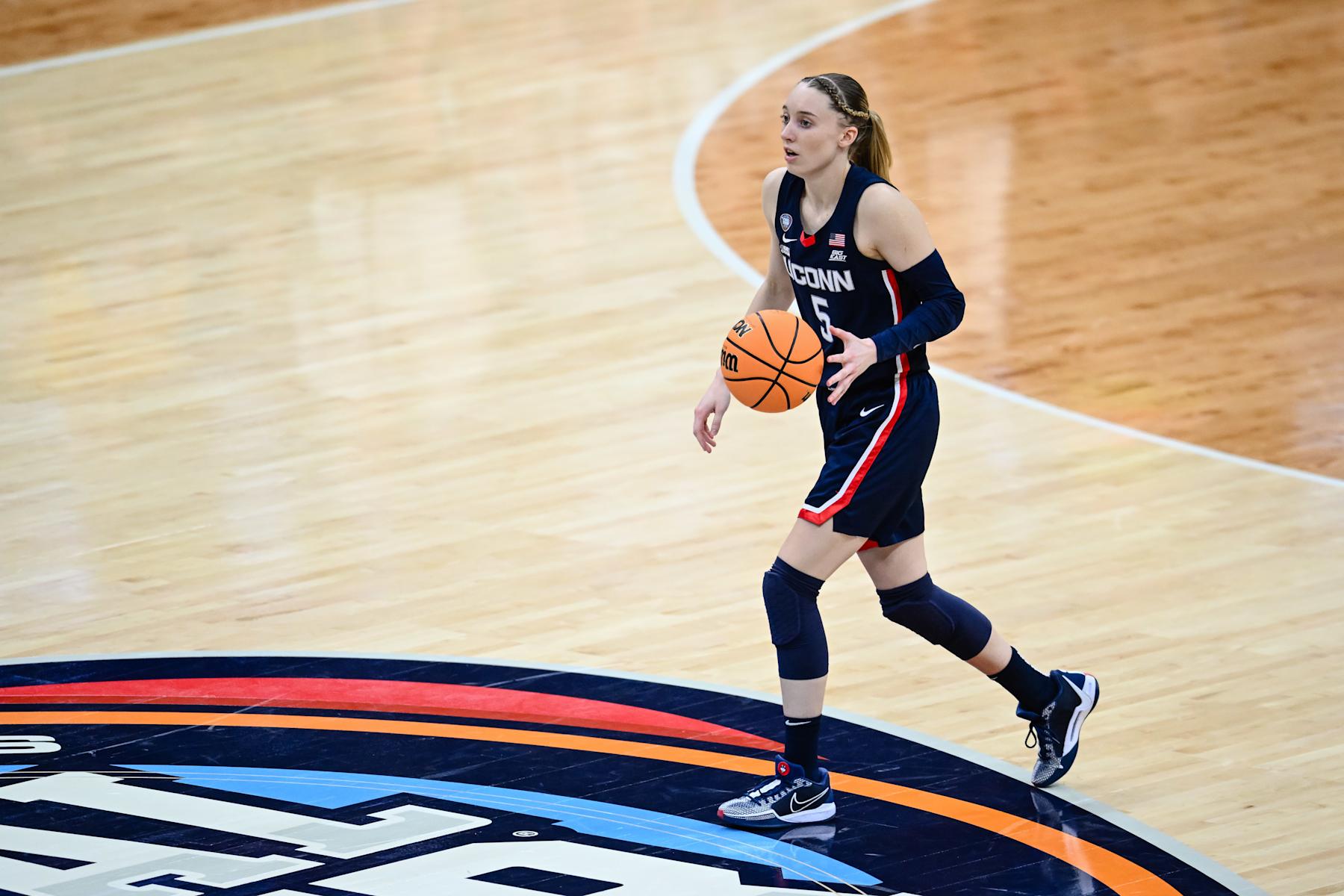 CLEVELAND, OH - APRIL 5: Paige Bueckers #5 of the Connecticut Huskies dribbles the ball against the Iowa Hawkeyes during the second half in the NCAA Women's Basketball Tournament Final Four semifinal game between Connecticut and Iowa at Rocket Mortgage FieldHouse on April 5, 2024 in Cleveland, Ohio. (Photo by Thien-An Truong/ISI Photos/Getty Images)