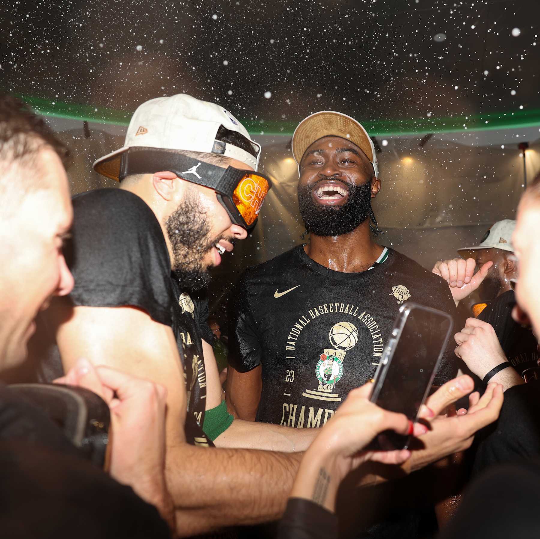 BOSTON, MA - JUNE 17: Jayson Tatum #0 and Jaylen Brown #7 of the Boston Celtics celebrate in the locker room after winning Game 5 of the 2024 NBA Finals against the Dallas Mavericks on June 17, 2024 at the TD Garden in Boston, Massachusetts. NOTE TO USER: User expressly acknowledges and agrees that, by downloading and or using this photograph, User is consenting to the terms and conditions of the Getty Images License Agreement. Mandatory Copyright Notice: Copyright 2024 NBAE  (Photo by Grace Beal/NBAE via Getty Images)