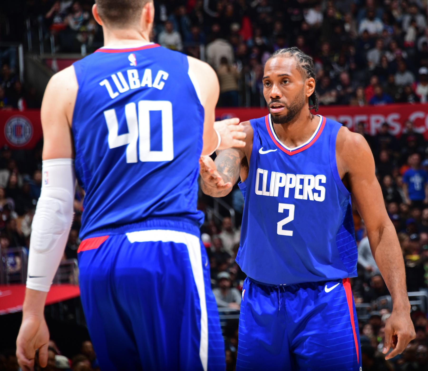 LOS ANGELES, CA - FEBRUARY 12: Ivica Zubac #40 and Kawhi Leonard #2 of the LA Clippers high five during the game against the Minnesota Timberwolves on February 12, 2024 at Crypto.Com Arena in Los Angeles, California. NOTE TO USER: User expressly acknowledges and agrees that, by downloading and/or using this Photograph, user is consenting to the terms and conditions of the Getty Images License Agreement. Mandatory Copyright Notice: Copyright 2024 NBAE (Photo by Adam Pantozzi/NBAE via Getty Images)