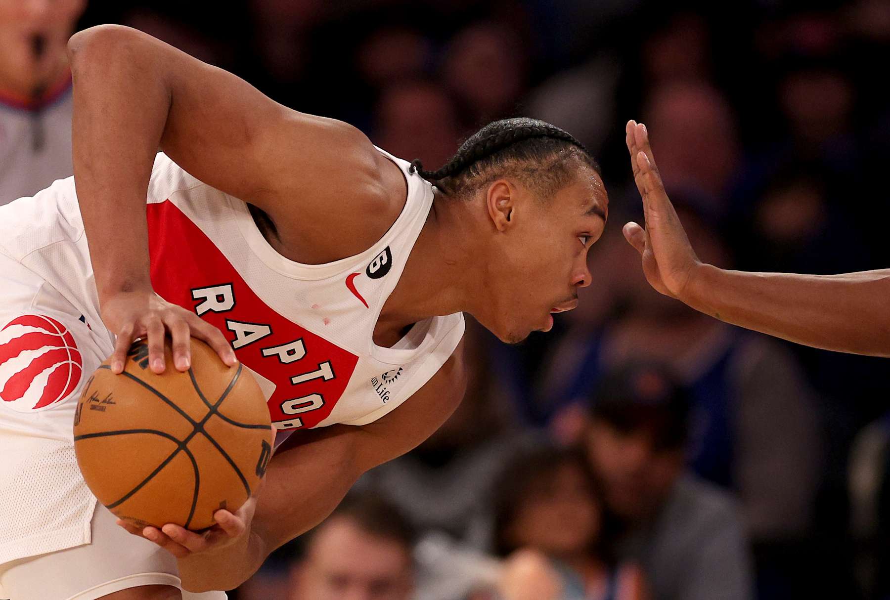 NEW YORK, NEW YORK - JANUARY 16: Scottie Barnes #4 of the Toronto Raptors tries to get by RJ Barrett #9 of the New York Knicks during the second half at Madison Square Garden on January 16, 2023 in New York City. The Toronto Raptors defeated the New York Knicks 123-121 in overtime. NOTE TO USER: User expressly acknowledges and agrees that, by downloading and or using this photograph, User is consenting to the terms and conditions of the Getty Images License Agreement. (Photo by Elsa/Getty Images)