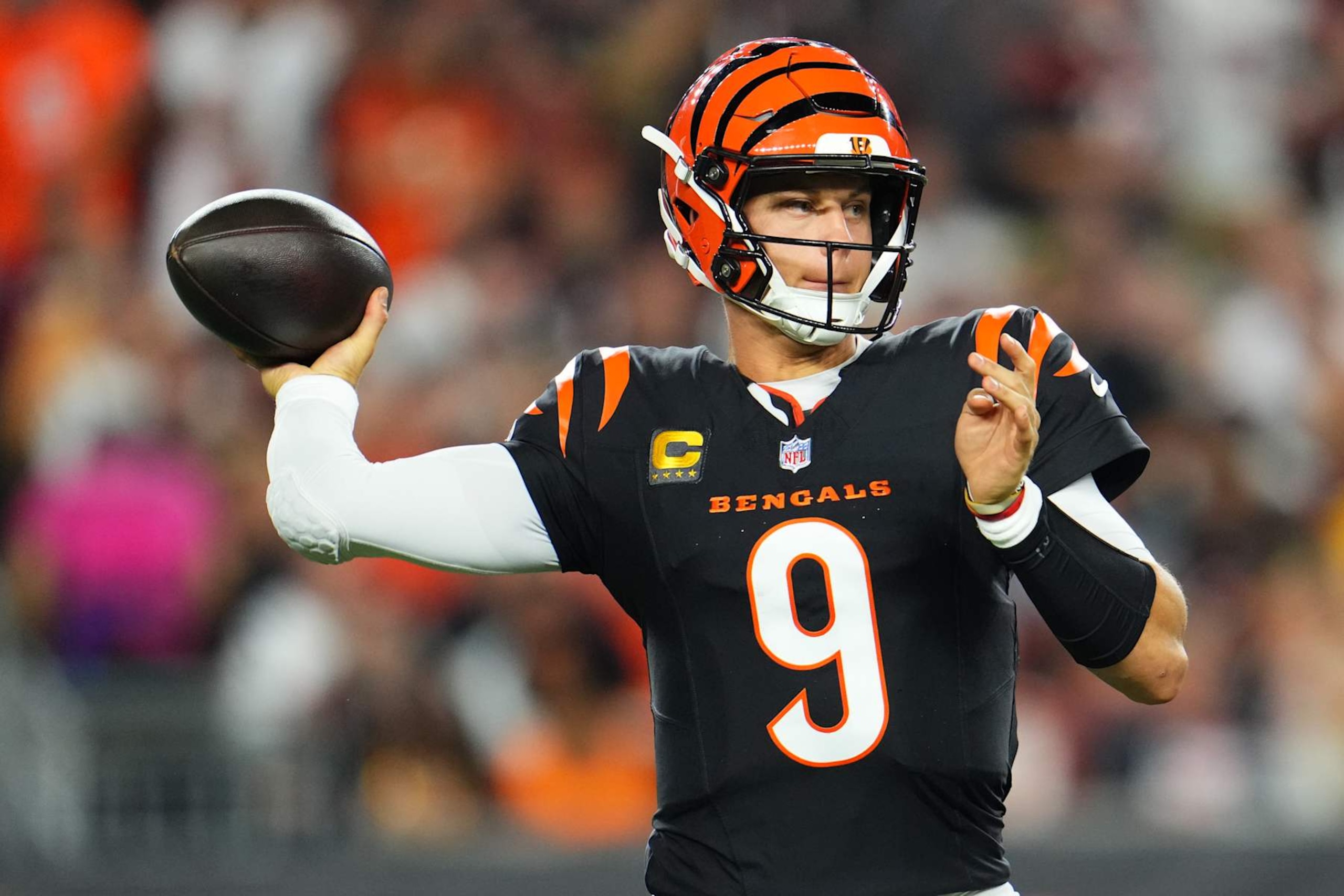 CINCINNATI, OH - SEPTEMBER 23: Joe Burrow #9 of the Cincinnati Bengals drops back to pass against the Washington Commanders during the first half of an NFL football game at Paycor Stadium on September 23, 2024 in Cincinnati, Ohio. (Photo by Cooper Neill/Getty Images) CINCINNATI, OH - SEPTEMBER 23: Joe Burrow #9 of the Cincinnati Bengals drops back to pass against the Washington Commanders during the first half of an NFL football game at Paycor Stadium on September 23, 2024 in Cincinnati, Ohio. (Photo by Cooper Neill/Getty Images)