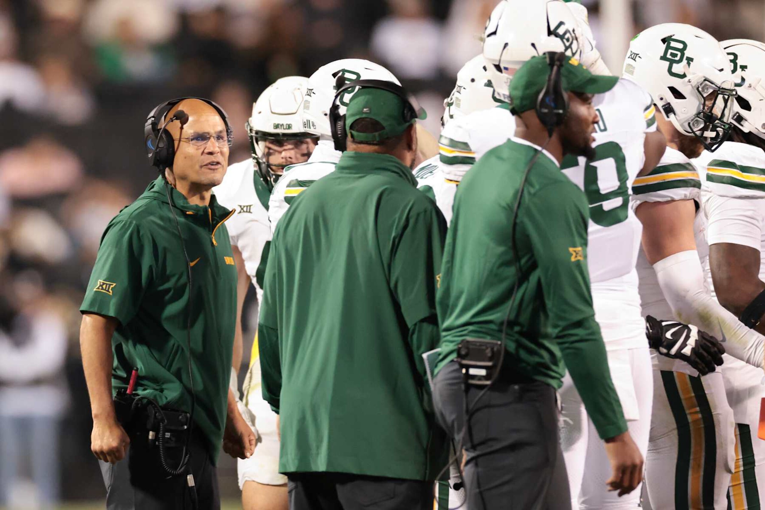 BOULDER, COLORADO - SEPTEMBER 21: Head coach Dave Aranda of the Baylor Bears talks to players in a huddle during the second half against the Colorado Buffaloes at Folsom Field on September 21, 2024 in Boulder, Colorado. (Photo by Andrew Wevers/Getty Images)