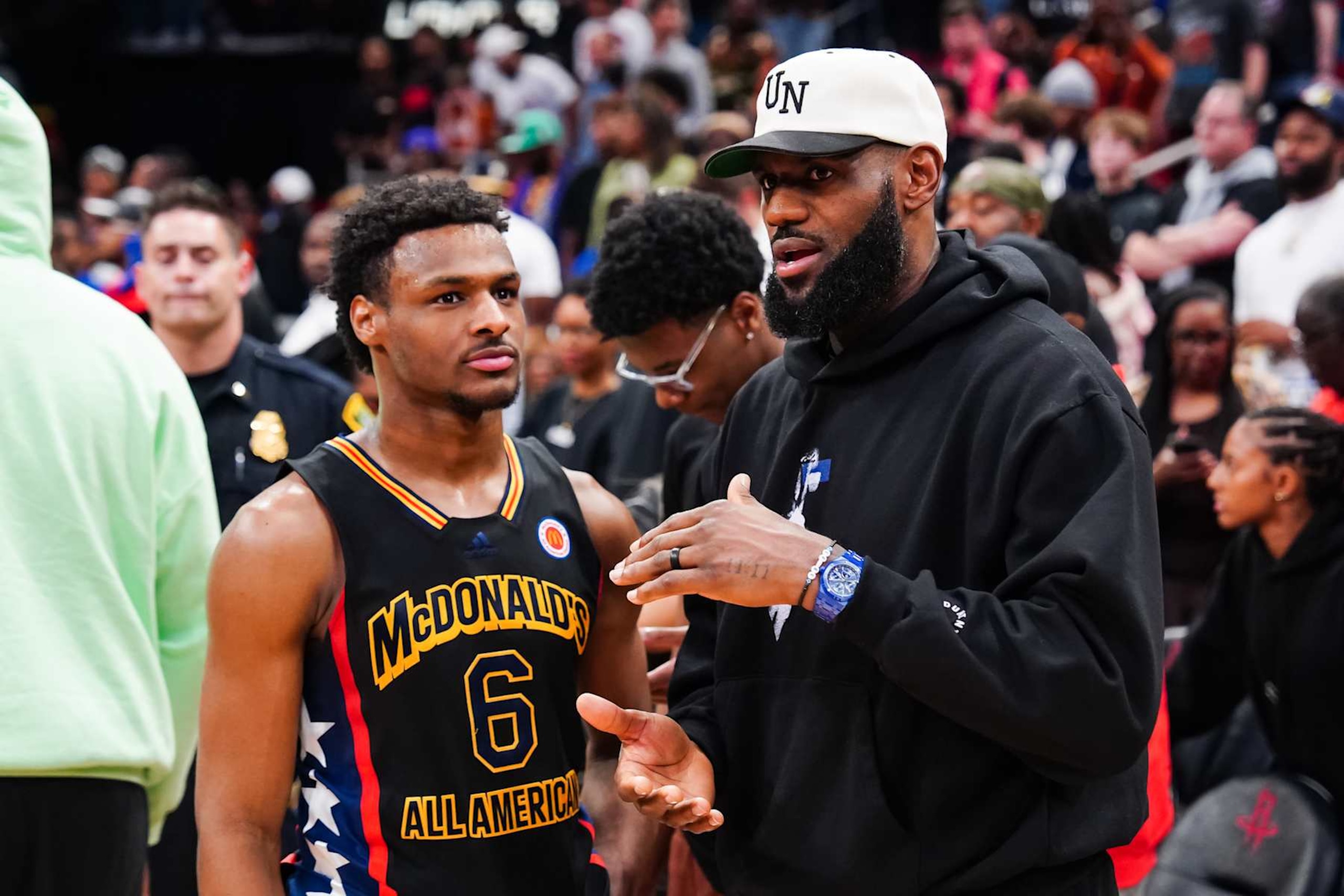 HOUSTON, TEXAS - MARCH 28: Bronny James #6 of the West team talks to Lebron James of the Los Angeles Lakers after the 2023 McDonald's High School Boys All-American Game at Toyota Center on March 28, 2023 in Houston, Texas. (Photo by Alex Bierens de Haan/Getty Images) HOUSTON, TEXAS - MARCH 28: Bronny James #6 of the West team talks to Lebron James of the Los Angeles Lakers after the 2023 McDonald's High School Boys All-American Game at Toyota Center on March 28, 2023 in Houston, Texas. (Photo by Alex Bierens de Haan/Getty Images)