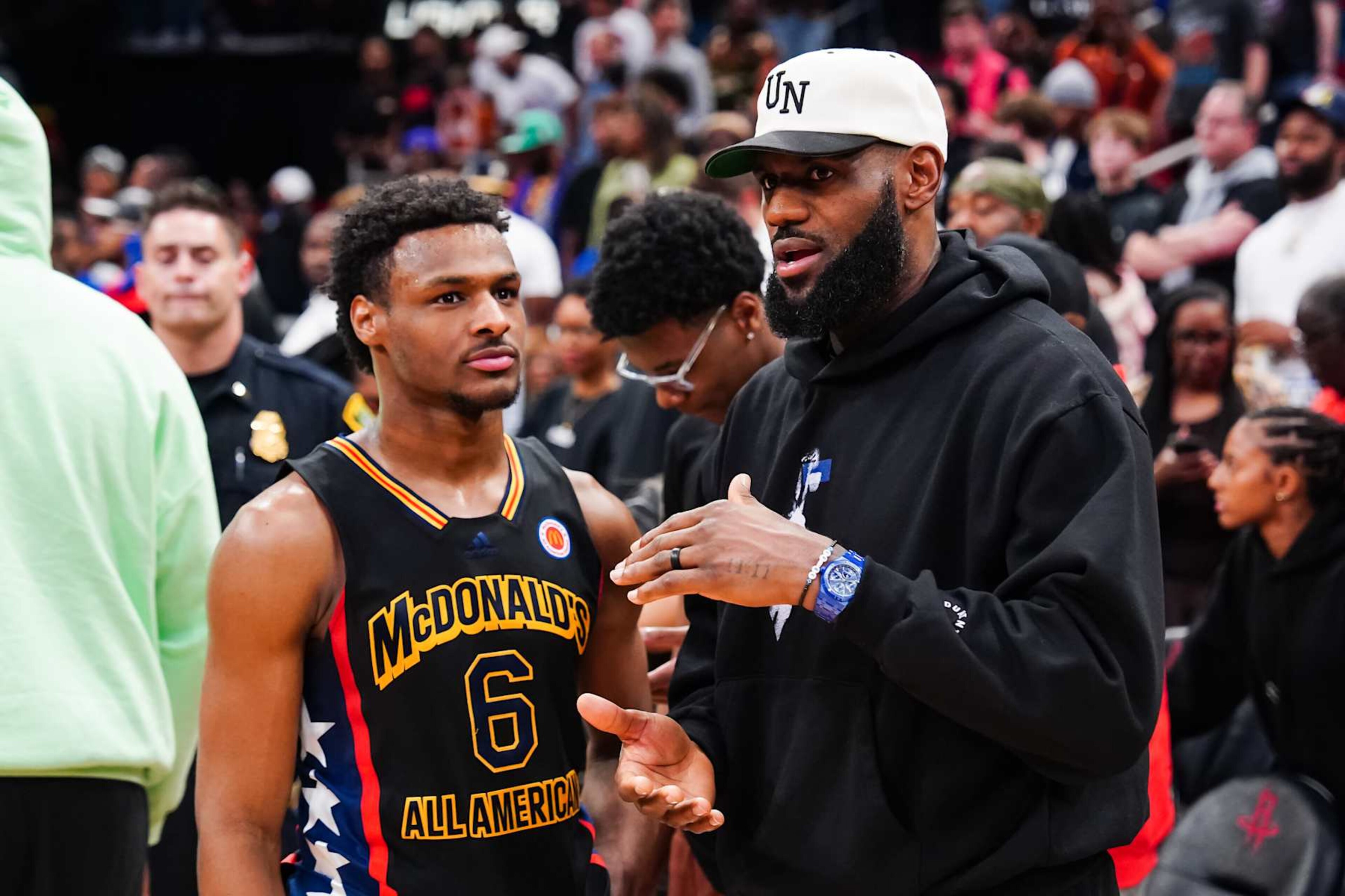 HOUSTON, TEXAS - MARCH 28: Bronny James #6 of the West team talks to Lebron James of the Los Angeles Lakers after the 2023 McDonald's High School Boys All-American Game at Toyota Center on March 28, 2023 in Houston, Texas. (Photo by Alex Bierens de Haan/Getty Images) HOUSTON, TEXAS - MARCH 28: Bronny James #6 of the West team talks to Lebron James of the Los Angeles Lakers after the 2023 McDonald's High School Boys All-American Game at Toyota Center on March 28, 2023 in Houston, Texas. (Photo by Alex Bierens de Haan/Getty Images)