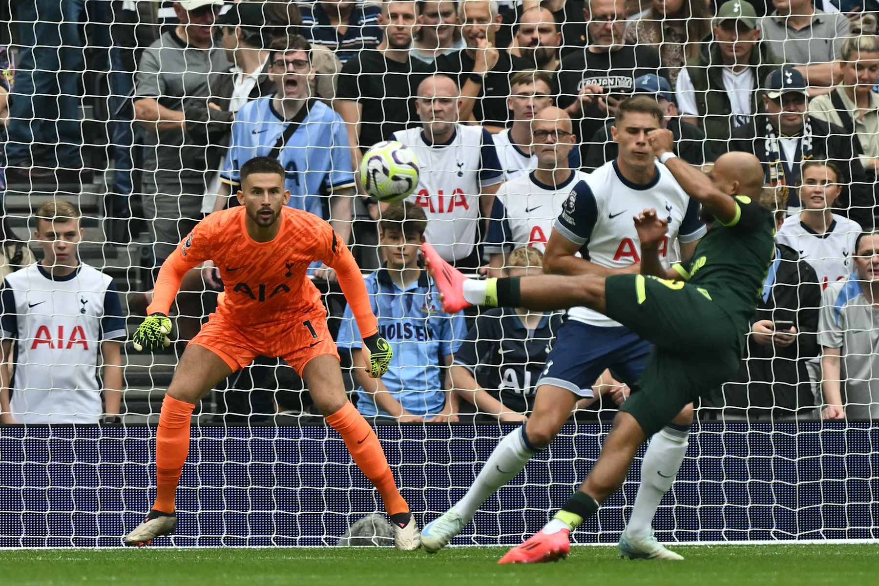 Brentford's French-born Cameroonian striker #19 Bryan Mbeumo shoots to score the opening goal of the English Premier League football match between Tottenham Hotspur and Brentford at the Tottenham Hotspur Stadium in London, on September 21, 2024. (Photo by Glyn KIRK / AFP) / RESTRICTED TO EDITORIAL USE. No use with unauthorized audio, video, data, fixture lists, club/league logos or 'live' services. Online in-match use limited to 120 images. An additional 40 images may be used in extra time. No video emulation. Social media in-match use limited to 120 images. An additional 40 images may be used in extra time. No use in betting publications, games or single club/league/player publications. / (Photo by GLYN KIRK/AFP via Getty Images)