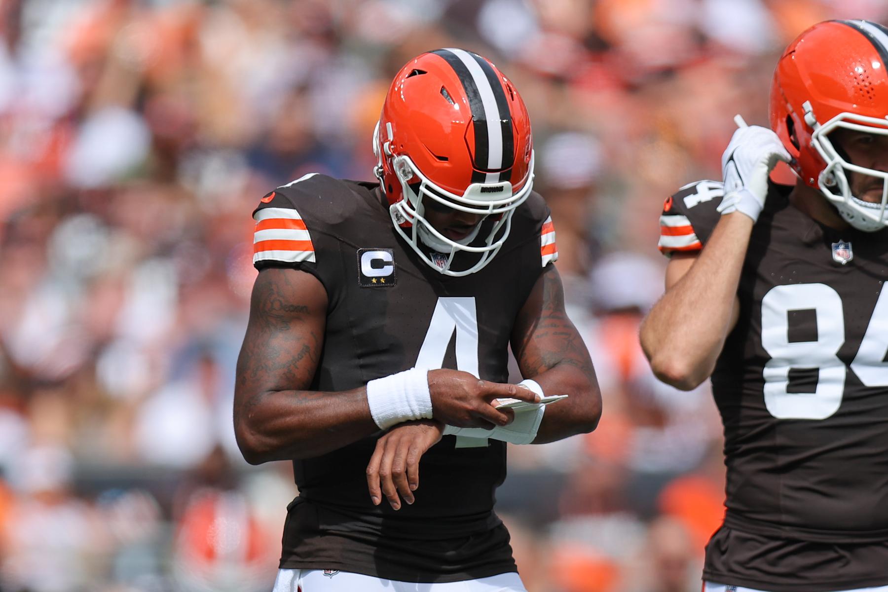 CLEVELAND, OH - SEPTEMBER 22: Cleveland Browns quarterback Deshaun Watson (4) checks his wristband for a play during first quarter of the National Football League game between the New York Giants and Cleveland Browns on September 22, 2024, at Huntington Bank Field  in Cleveland, OH. (Photo by Frank Jansky/Icon Sportswire via Getty Images)