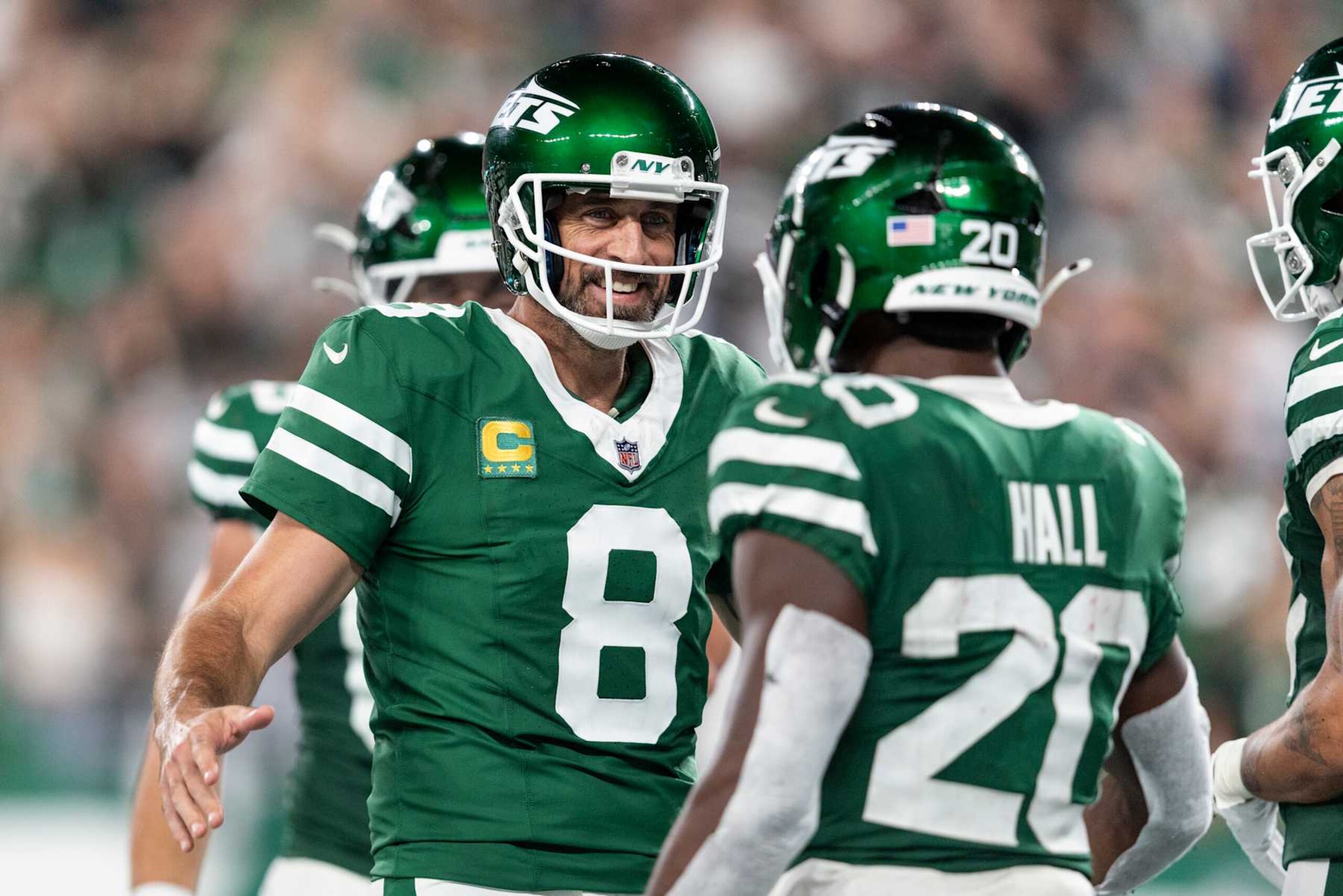 EAST RUTHERFORD, NEW JERSEY - SEPTEMBER 19: Aaron Rodgers #8 of the New York Jets celebrates with Breece Hall #20 of the New York Jets after a touchdown during an NFL football game between the New York Jets and the New England Patriots at MetLife Stadium on September 19, 2024 in East Rutherford, New Jersey. (Photo by Michael Owens/Getty Images)