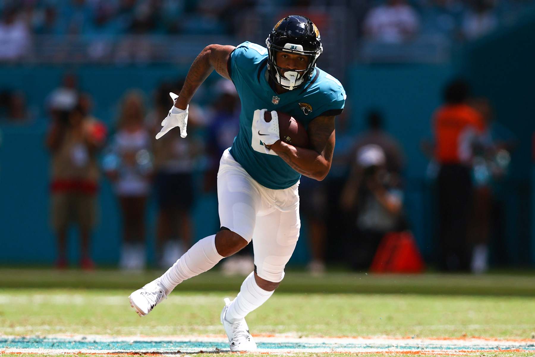 MIAMI GARDENS, FLORIDA - SEPTEMBER 08: Gabe Davis #0 of the Jacksonville Jaguars carries the ball against the Miami Dolphins during the second quarter of the game at Hard Rock Stadium on September 08, 2024 in Miami Gardens, Florida. (Photo by Megan Briggs/Getty Images)