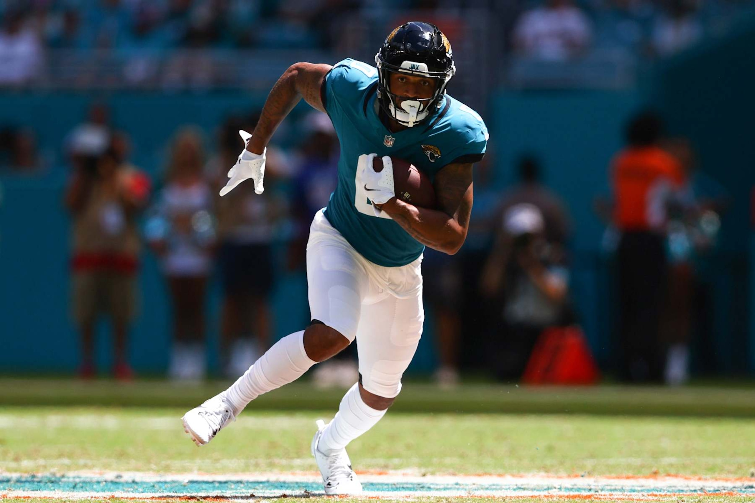 MIAMI GARDENS, FLORIDA - SEPTEMBER 08: Gabe Davis #0 of the Jacksonville Jaguars carries the ball against the Miami Dolphins during the second quarter of the game at Hard Rock Stadium on September 08, 2024 in Miami Gardens, Florida. (Photo by Megan Briggs/Getty Images)