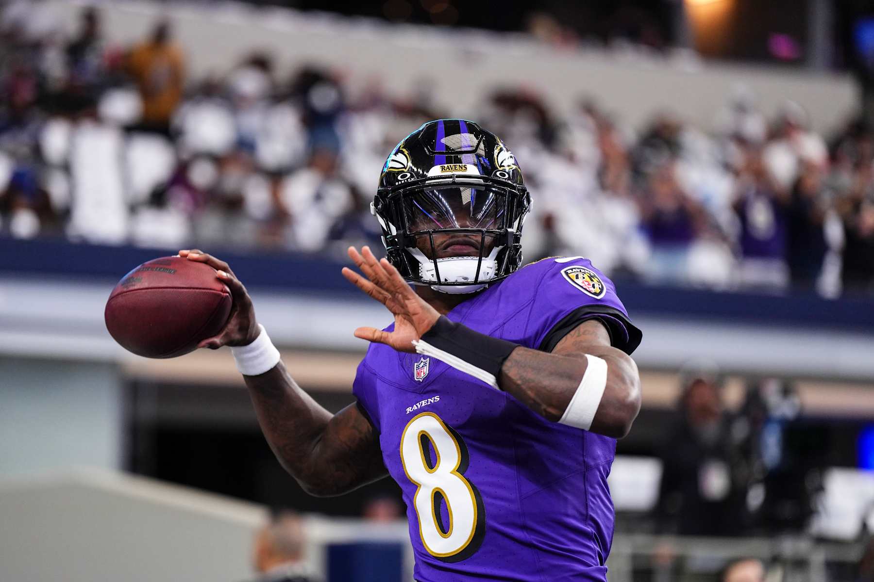 ARLINGTON, TX - SEPTEMBER 22: Lamar Jackson #8 of the Baltimore Ravens warms up prior to an NFL football game against the Dallas Cowboys at AT&T Stadium on September 22, 2024 in Arlington, Texas. (Photo by Cooper Neill/Getty Images)