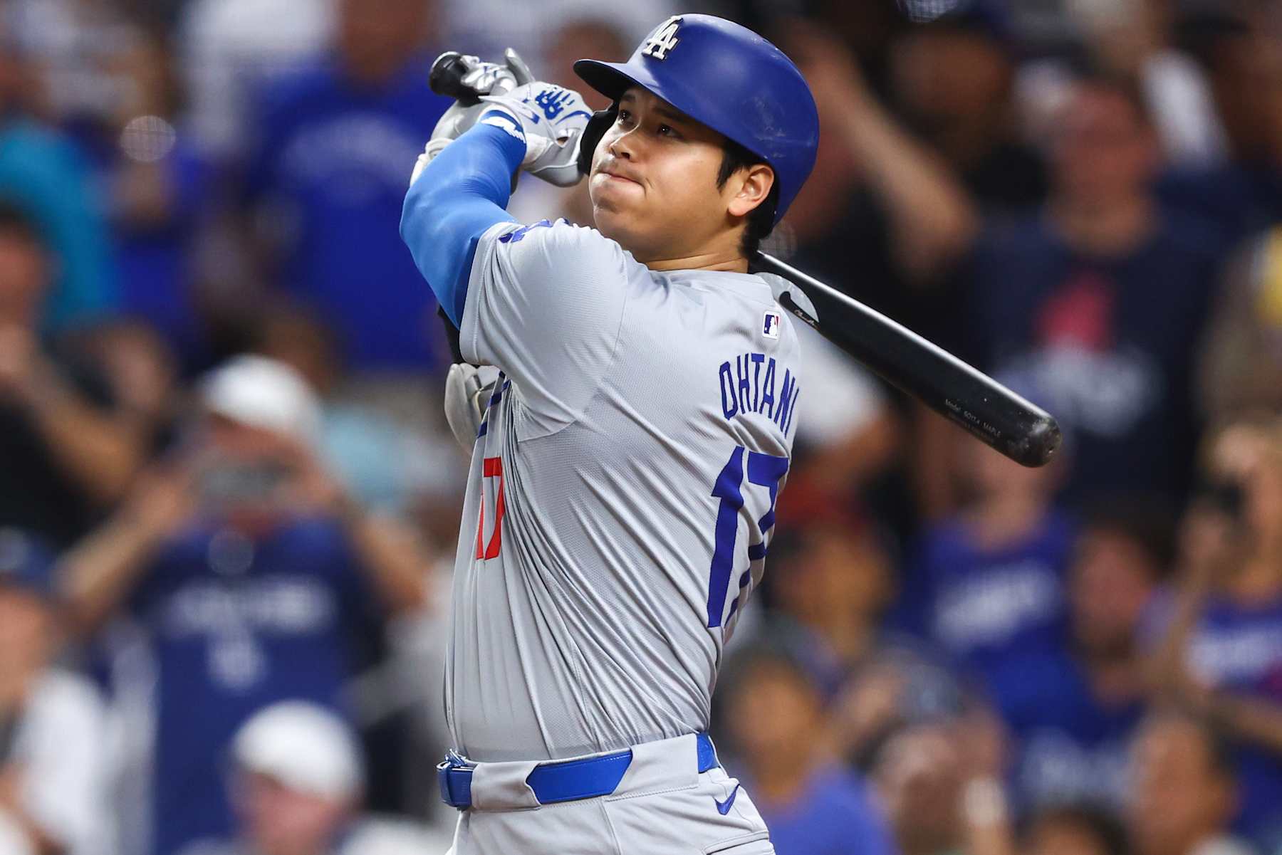 MIAMI, FLORIDA - SEPTEMBER 19: Shohei Ohtani #17 of the Los Angeles Dodgers hits a two-run home run, his 50th of the season, becoming the first player with a 50/50 season in MLB history, during the seventh inning against the Miami Marlins at loanDepot park on September 19, 2024 in Miami, Florida. (Photo by Megan Briggs/Getty Images)