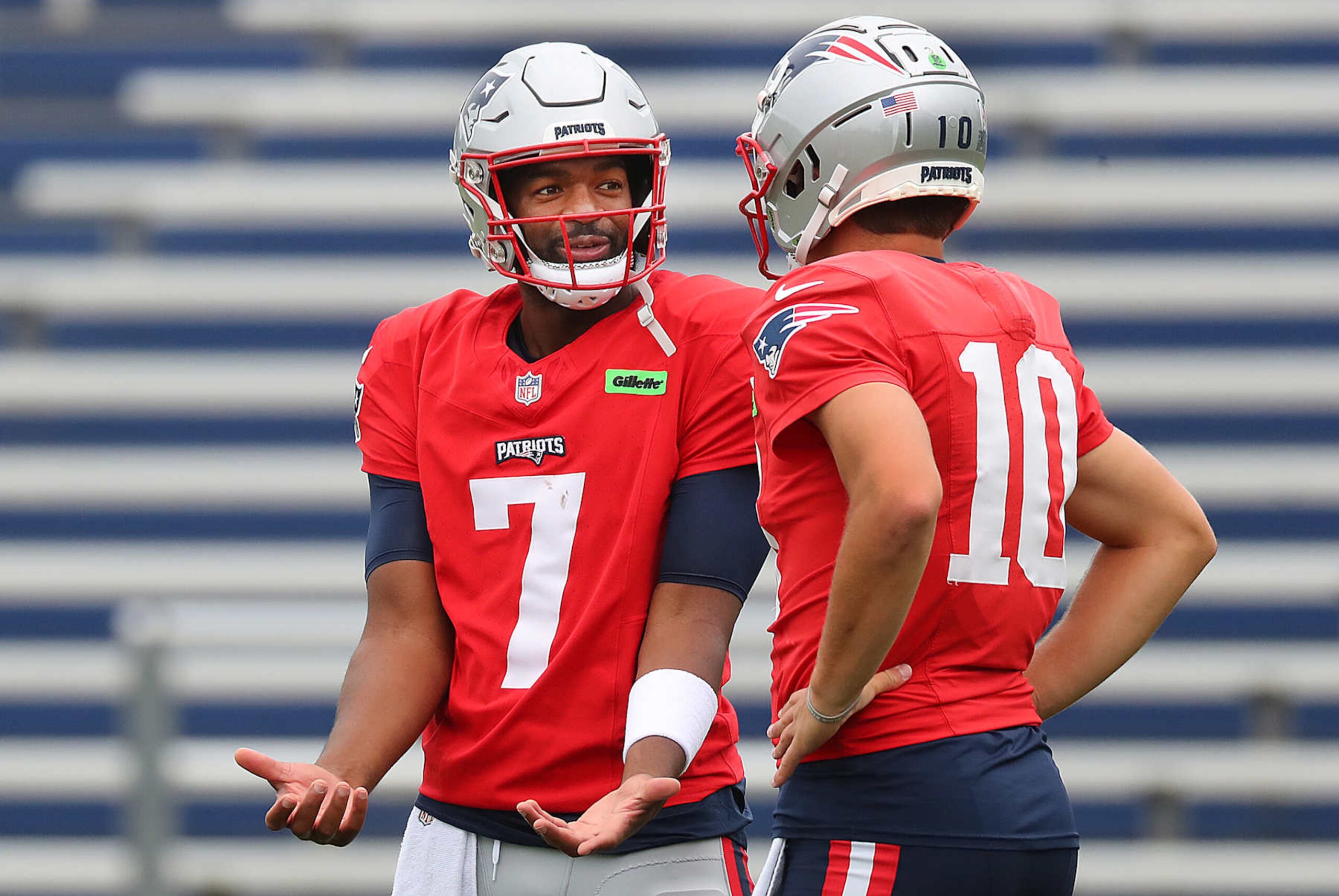 Foxborough, MA - September 25: New England Patriots QB Jacoby Brissett chats with Drake Maye during practice. (Photo by John Tlumacki/The Boston Globe via Getty Images) Foxborough, MA - September 25: New England Patriots QB Jacoby Brissett chats with Drake Maye during practice. (Photo by John Tlumacki/The Boston Globe via Getty Images)