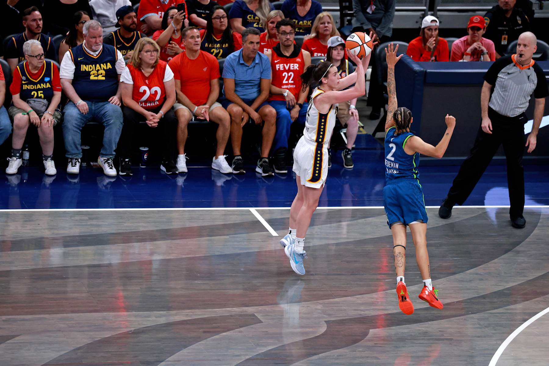 INDIANAPOLIS, IN - SEPTEMBER 06: Indiana Fever guard Caitlin Clark (22) takes a 3 point shot against Minnesota Lynx guard Natisha Hiedeman (2) on September 6, 2024, at Gainbridge Fieldhouse in Indianapolis, Indiana. (Photo by Brian Spurlock/Icon Sportswire via Getty Images)