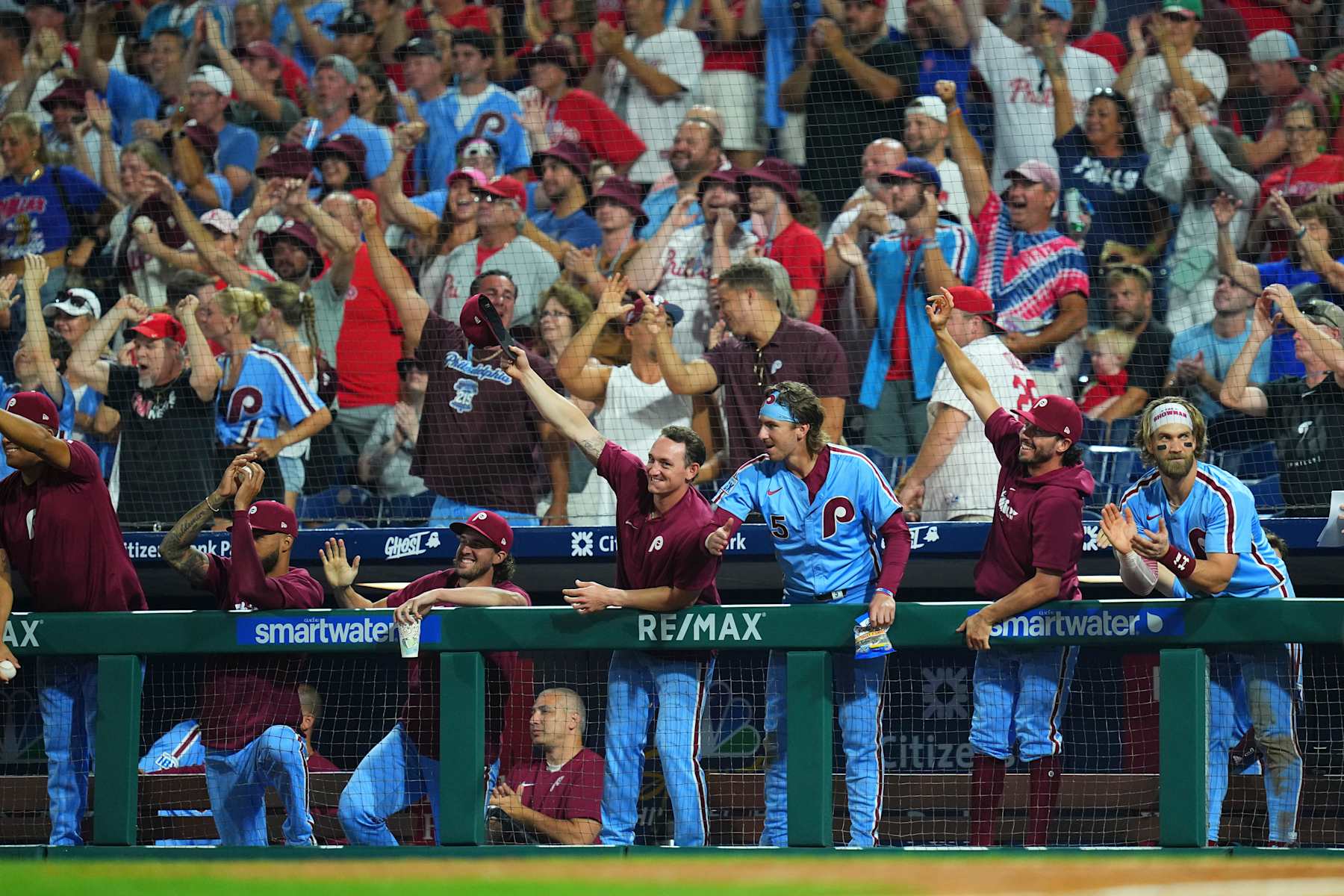 PHILADELPHIA, PENNSYLVANIA - AUGUST 15: (L-R) Cristopher Sánchez #61, Aaron Nola #27, Austin Hays #9, Bryson Stott #5, Garrett Stubbs #21, and Bryce Harper #3 of the Philadelphia Phillies react after Weston Wilson #37 of the Philadelphia Phillies hit a double for the cycle in the bottom of the eighth inning against the Washington Nationals at Citizens Bank Park on August 15, 2024 in Philadelphia, Pennsylvania. The Phillies defeated the Nationals 13-3. (Photo by Mitchell Leff/Getty Images)