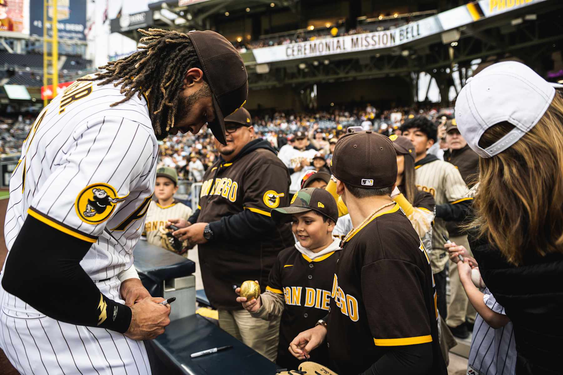 SAN DIEGO, CA - MAY 1: Fernando Tatis Jr. #23 of the San Diego Padres signs autographs for fans before the game against the Cincinnati Reds on May 1, 2023 at Petco Park in San Diego, California. (Photo by Matt Thomas/San Diego Padres/Getty Images)