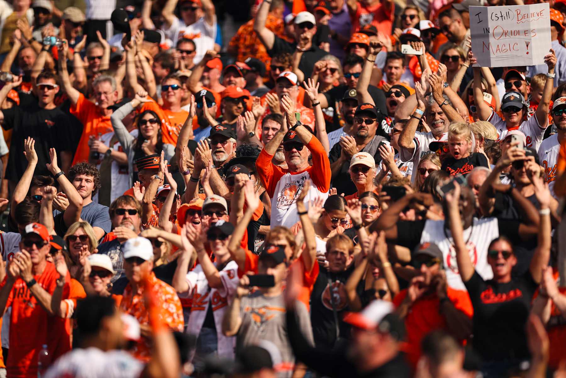 BALTIMORE, MD - SEPTEMBER 19: Fans celebrate after Anthony Santander #25 of the Baltimore Orioles hits the game winning two-run home run during the ninth inning against the San Francisco Giants at Oriole Park at Camden Yards on September 19, 2024 in Baltimore, Maryland. (Photo by Scott Taetsch/Getty Images)