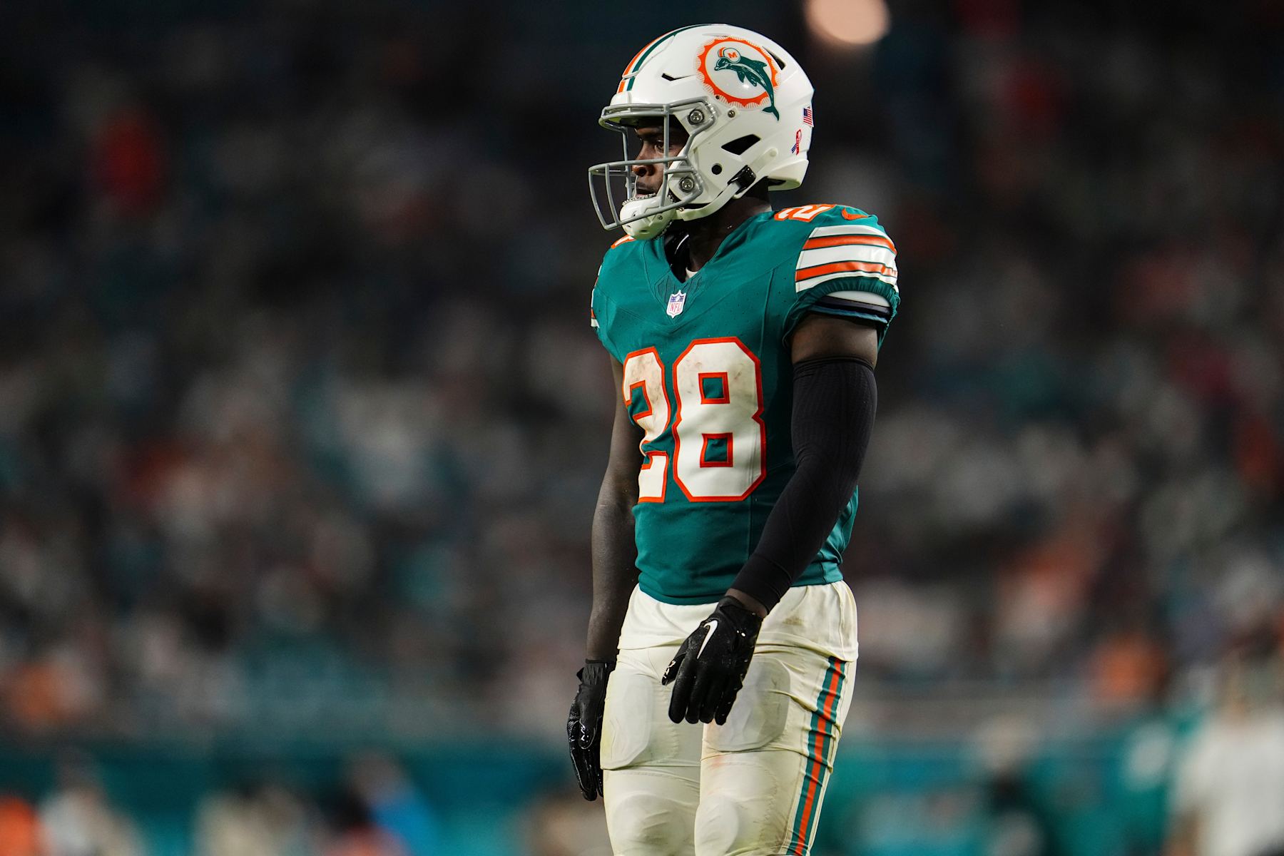 MIAMI GARDENS, FL - SEPTEMBER 12: De'Von Achane #28 of the Miami Dolphins looks on from the field during an NFL football game against the Buffalo Bills at Hard Rock Stadium on September 12, 2024 in Miami Gardens, Florida. (Photo by Cooper Neill/Getty Images)