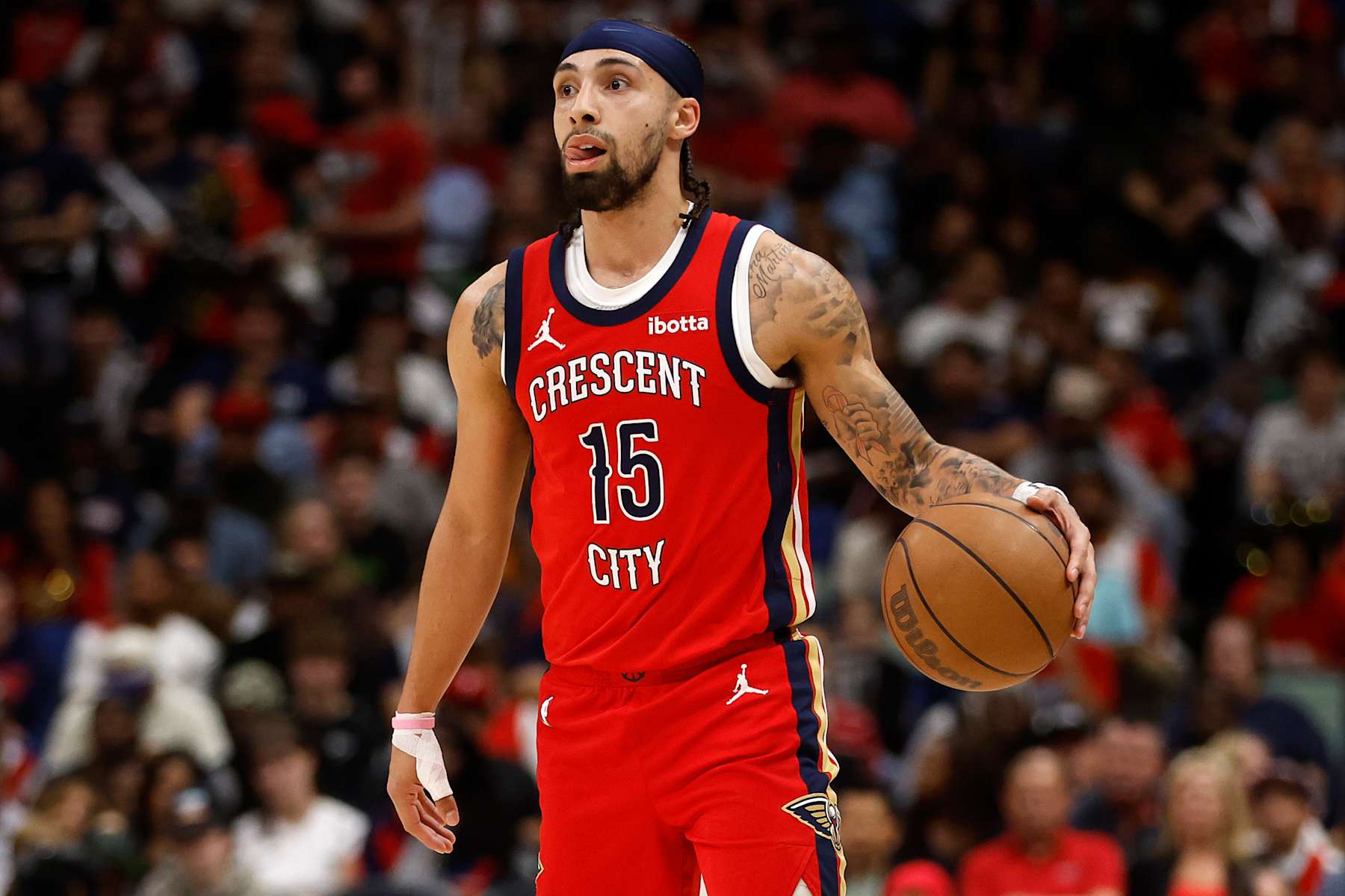 NEW ORLEANS, LOUISIANA - APRIL 19: Jose Alvarado #15 of the New Orleans Pelicans drives the ball up the court against the Sacramento Kings at Smoothie King Center on April 19, 2024 in New Orleans, Louisiana. NOTE TO USER: User expressly acknowledges and agrees that, by downloading and or using this photograph, User is consenting to the terms and conditions of the Getty Images License Agreement.  (Photo by Chris Graythen/Getty Images)