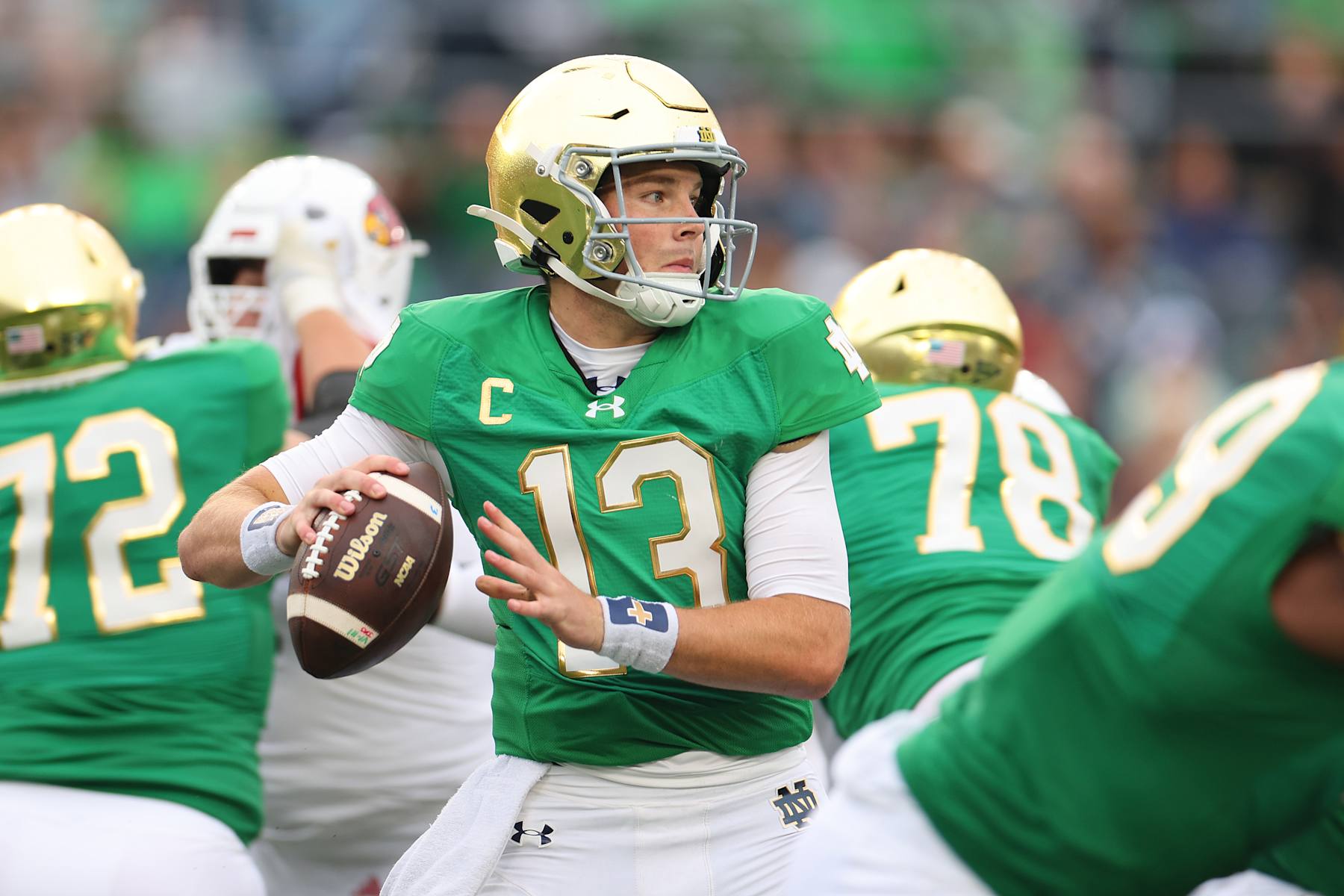 SOUTH BEND, INDIANA - SEPTEMBER 28: Riley Leonard #13 of the Notre Dame Fighting Irish looks to pass against the Louisville Cardinals during the first half at Notre Dame Stadium on September 28, 2024 in South Bend, Indiana. (Photo by Michael Reaves/Getty Images)