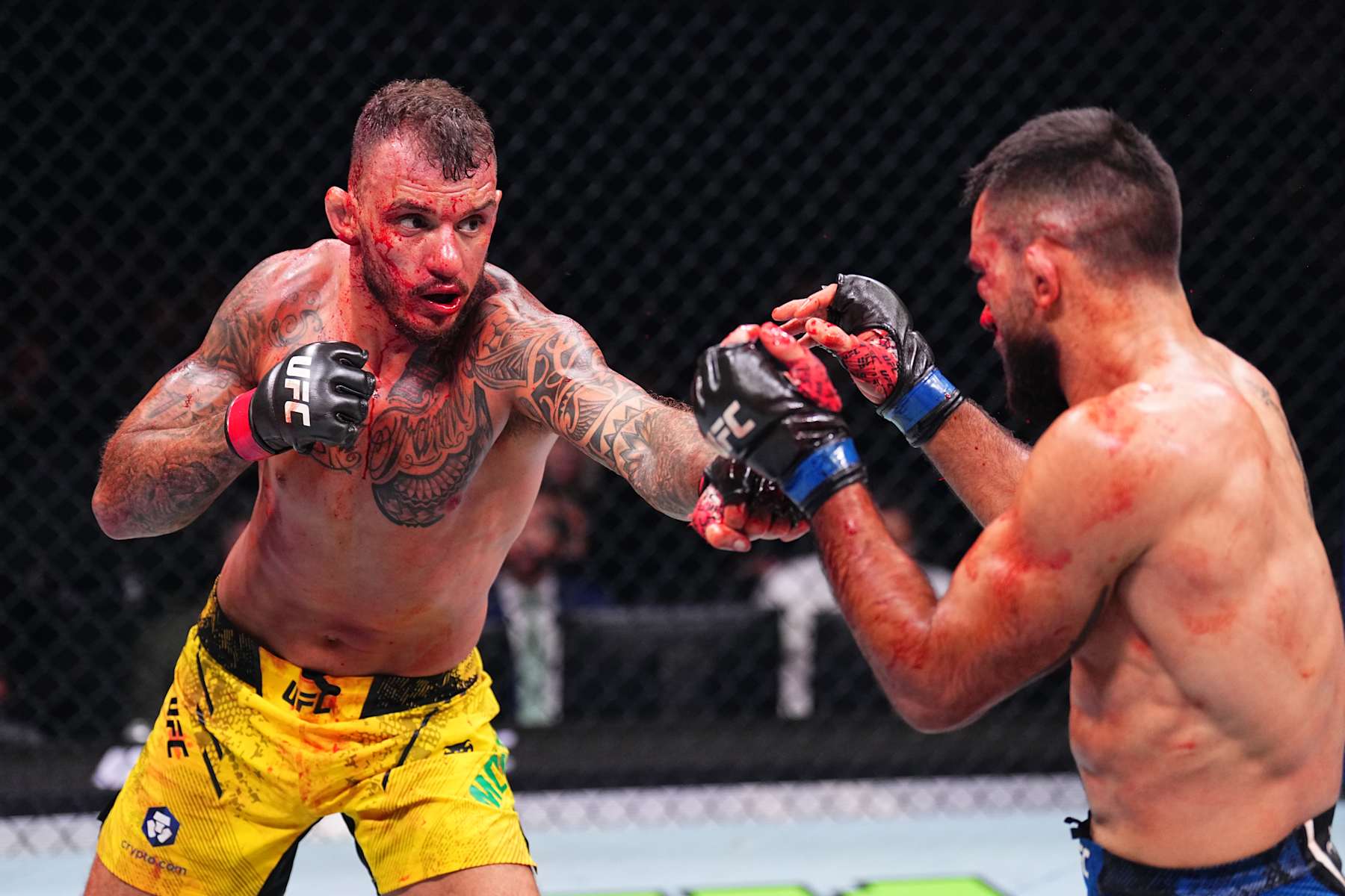 PARIS, FRANCE - SEPTEMBER 28: (L-R) Renato Moicano of Brazil punches Benoit Saint Denis of France in a lightweight fight during the UFC Fight Night event at The Accor Arena on September 28, 2024 in Paris, France. (Photo by Chris Unger/Zuffa LLC)