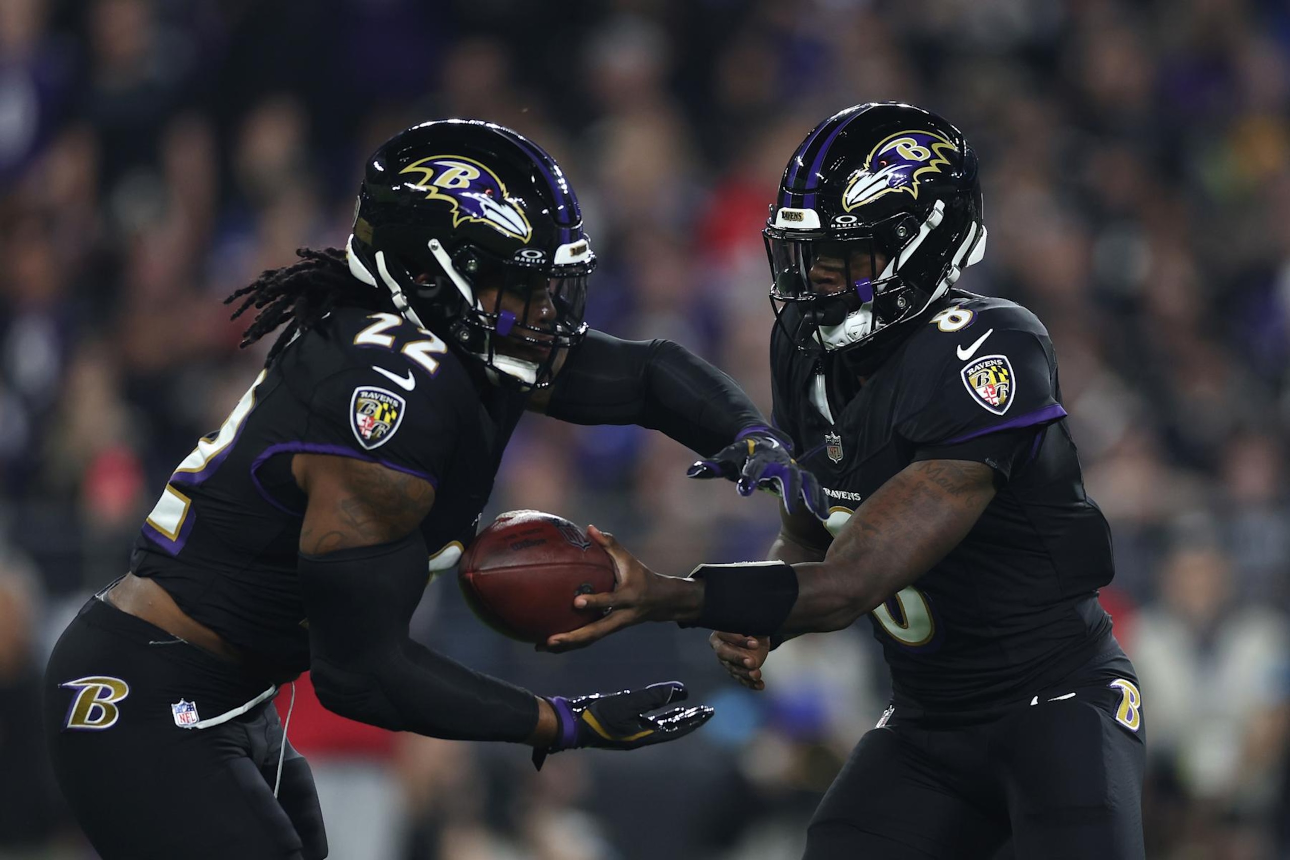 BALTIMORE, MARYLAND - SEPTEMBER 29: Lamar Jackson #8 of the Baltimore Ravens hands the ball off to Derrick Henry #22 of the Baltimore Ravens during the first quarter against the Buffalo Bills at M&T Bank Stadium on September 29, 2024 in Baltimore, Maryland. (Photo by Patrick Smith/Getty Images) BALTIMORE, MARYLAND - SEPTEMBER 29: Lamar Jackson #8 of the Baltimore Ravens hands the ball off to Derrick Henry #22 of the Baltimore Ravens during the first quarter against the Buffalo Bills at M&T Bank Stadium on September 29, 2024 in Baltimore, Maryland. (Photo by Patrick Smith/Getty Images)