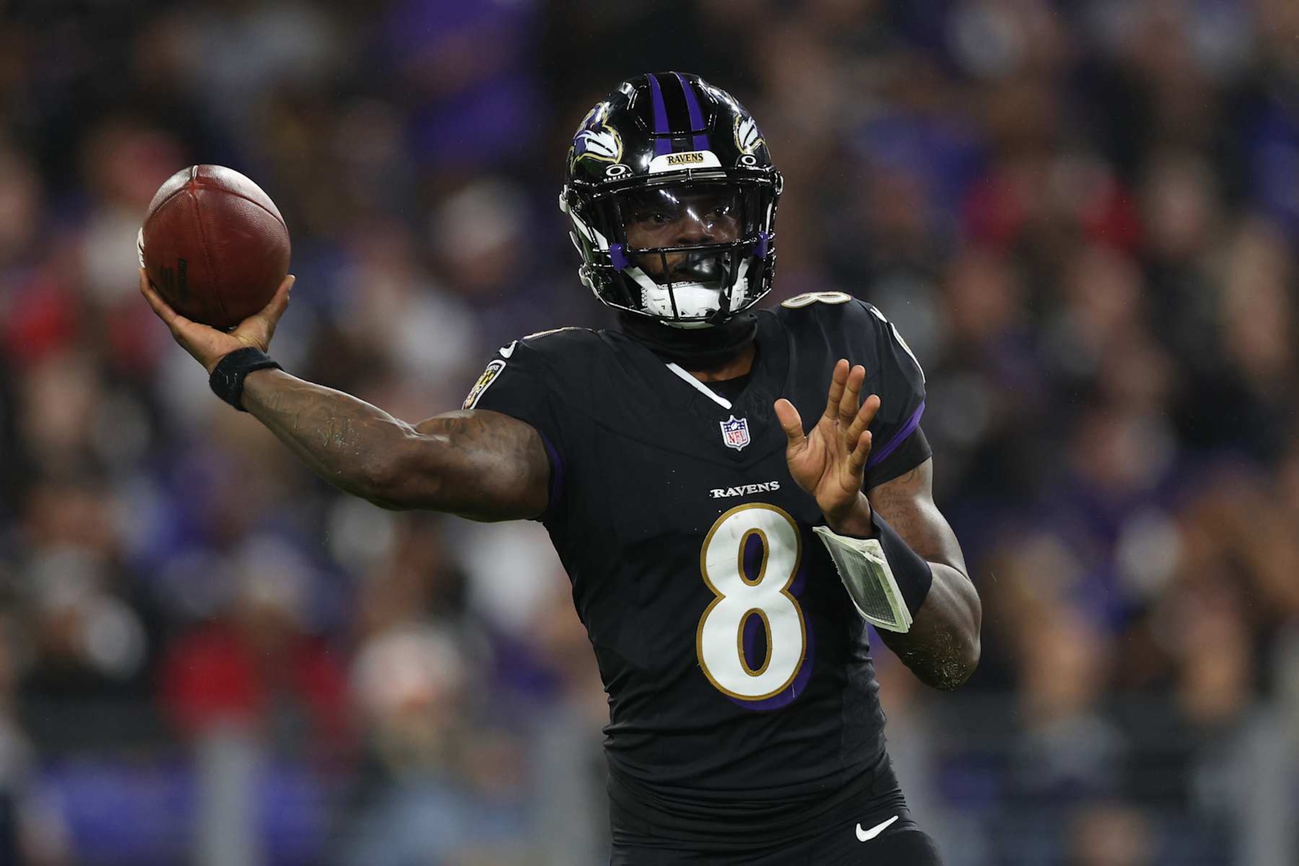 BALTIMORE, MARYLAND - SEPTEMBER 29: Lamar Jackson #8 of the Baltimore Ravens throws a pass during the third quarter against the Buffalo Bills at M&T Bank Stadium on September 29, 2024 in Baltimore, Maryland. (Photo by Patrick Smith/Getty Images) BALTIMORE, MARYLAND - SEPTEMBER 29: Lamar Jackson #8 of the Baltimore Ravens throws a pass during the third quarter against the Buffalo Bills at M&T Bank Stadium on September 29, 2024 in Baltimore, Maryland. (Photo by Patrick Smith/Getty Images)