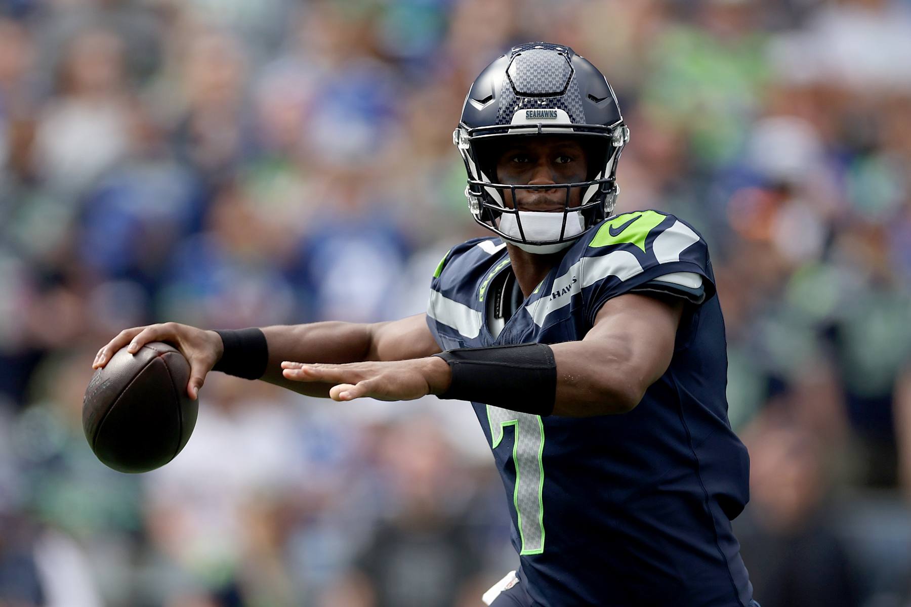 SEATTLE, WASHINGTON - SEPTEMBER 22: Quarterback Geno Smith #7 of the Seattle Seahawks passes against the Miami Dolphins at Lumen Field on September 22, 2024 in Seattle, Washington. (Photo by Steph Chambers/Getty Images)
