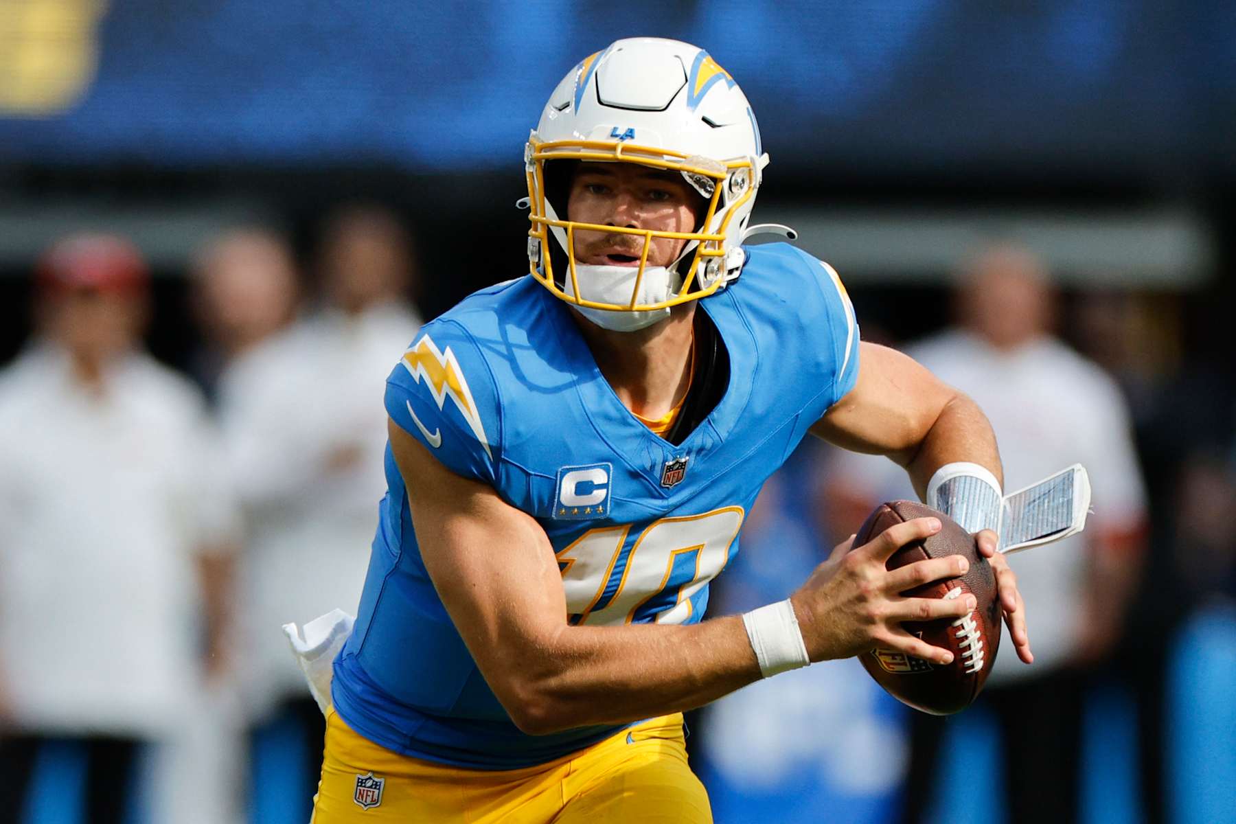 INGLEWOOD, CALIFORNIA - SEPTEMBER 29: Justin Herbert #10 of the Los Angeles Chargers scrambles with the ball during the third quarter against the Kansas City Chiefs at SoFi Stadium on September 29, 2024 in Inglewood, California. (Photo by Kevork Djansezian/Getty Images)