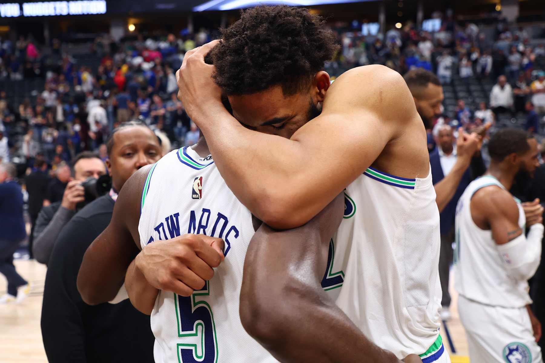 DENVER, COLORADO - MAY 19: Karl-Anthony Towns #32 and Anthony Edwards #5 of the Minnesota Timberwolves hug after winning Game Seven of the Western Conference Second Round Playoffs against the Denver Nuggets at Ball Arena on May 19, 2024 in Denver, Colorado. NOTE TO USER: User expressly acknowledges and agrees that, by downloading and or using this photograph, User is consenting to the terms and conditions of the Getty Images License Agreement. (Photo by C. Morgan Engel/Getty Images)