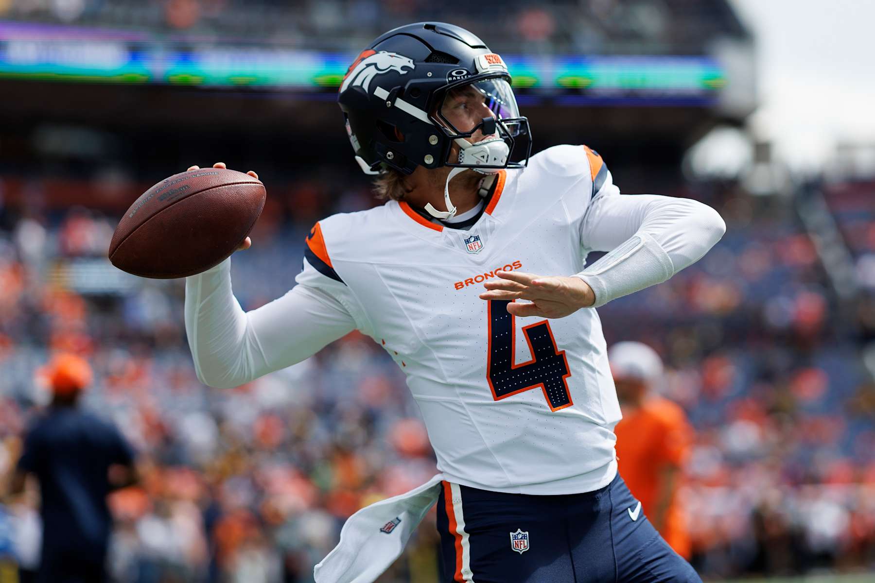 DENVER, CO - SEPTEMBER 15: Quarterback Zach Wilson #4 of the Denver Broncos warms up prior to an NFL football game against the Pittsburgh Steelers, at Empower Field at Mile High on September 15, 2024 in Denver, Colorado. (Photo by Brooke Sutton/Getty Images) DENVER, CO - SEPTEMBER 15: Quarterback Zach Wilson #4 of the Denver Broncos warms up prior to an NFL football game against the Pittsburgh Steelers, at Empower Field at Mile High on September 15, 2024 in Denver, Colorado. (Photo by Brooke Sutton/Getty Images)