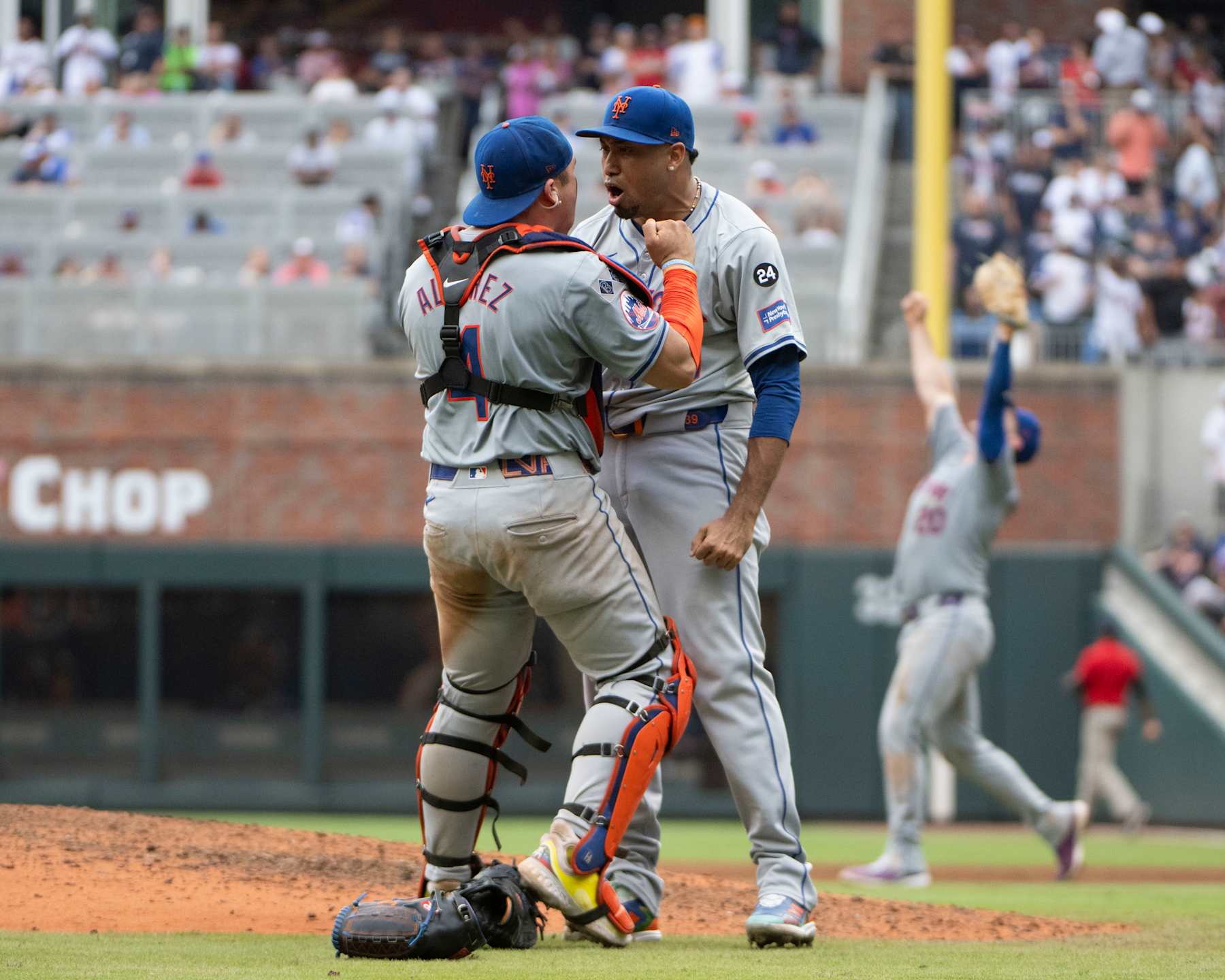 ATLANTA, GEORGIA - SEPTEMBER 30: Francisco Alvarez #4 of the New York Mets (left) and Edwin Diaz #39 celebrate after winning in the ninth inning of game one of a doubleheader against the Atlanta Braves at Truist Park on September 30, 2024 in Atlanta, Georgia. (Photo by Edward M. Pio Roda/Getty Images)