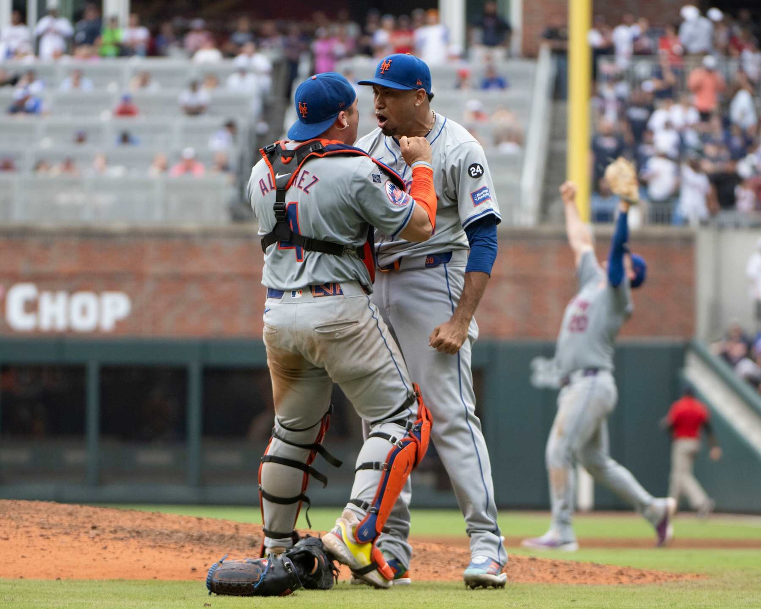ATLANTA, GEORGIA - SEPTEMBER 30: Francisco Alvarez #4 of the New York Mets (left) and Edwin Diaz #39 celebrate after winning in the ninth inning of game one of a doubleheader against the Atlanta Braves at Truist Park on September 30, 2024 in Atlanta, Georgia. (Photo by Edward M. Pio Roda/Getty Images)