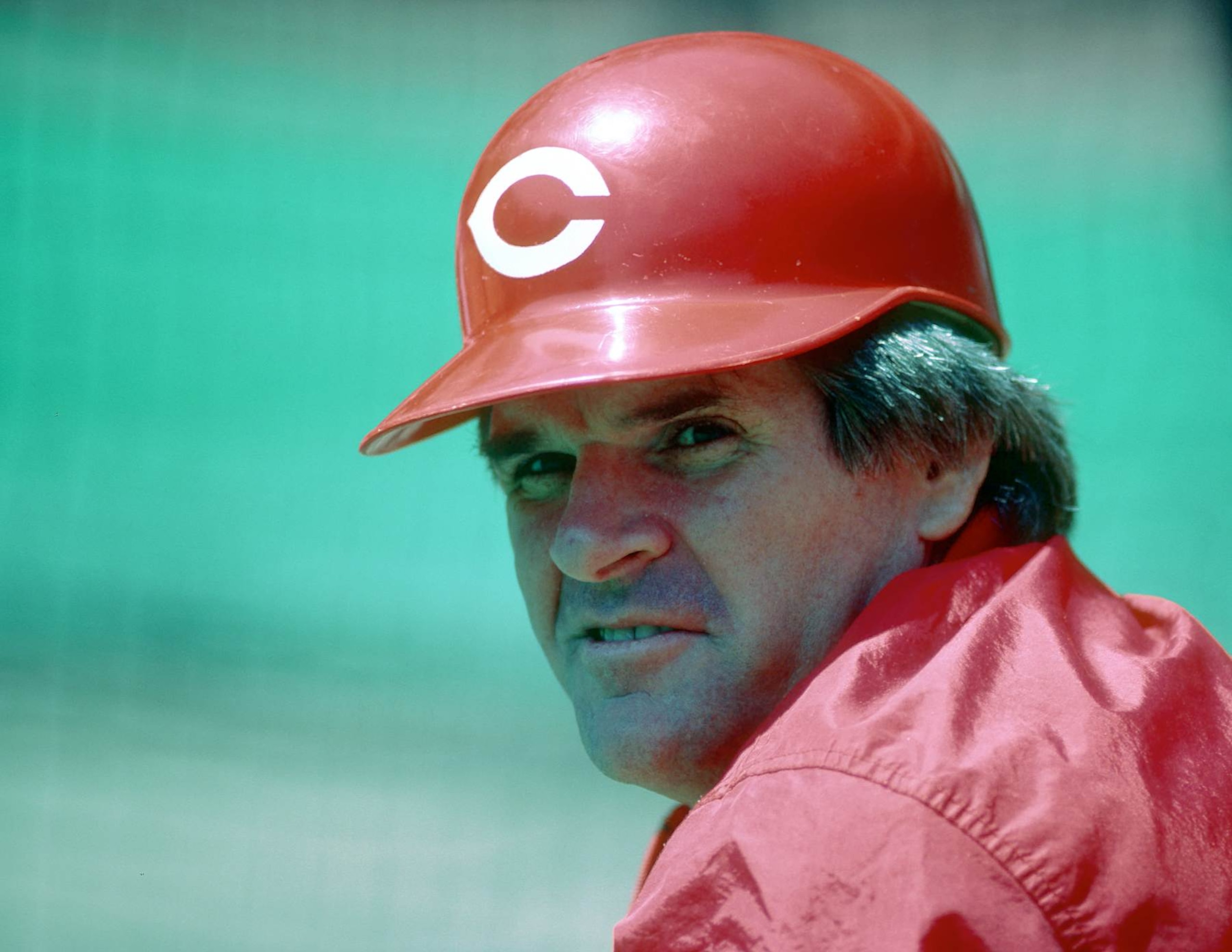 PITTSBURGH, PA - 1985:  Pete Rose of the Cincinnati Reds looks on from the field during batting practice before a Major League Baseball game against the Pittsburgh Pirates at Three Rivers Stadium in 1985 in Pittsburgh, Pennsylvania.  (Photo by George Gojkovich/Getty Images)