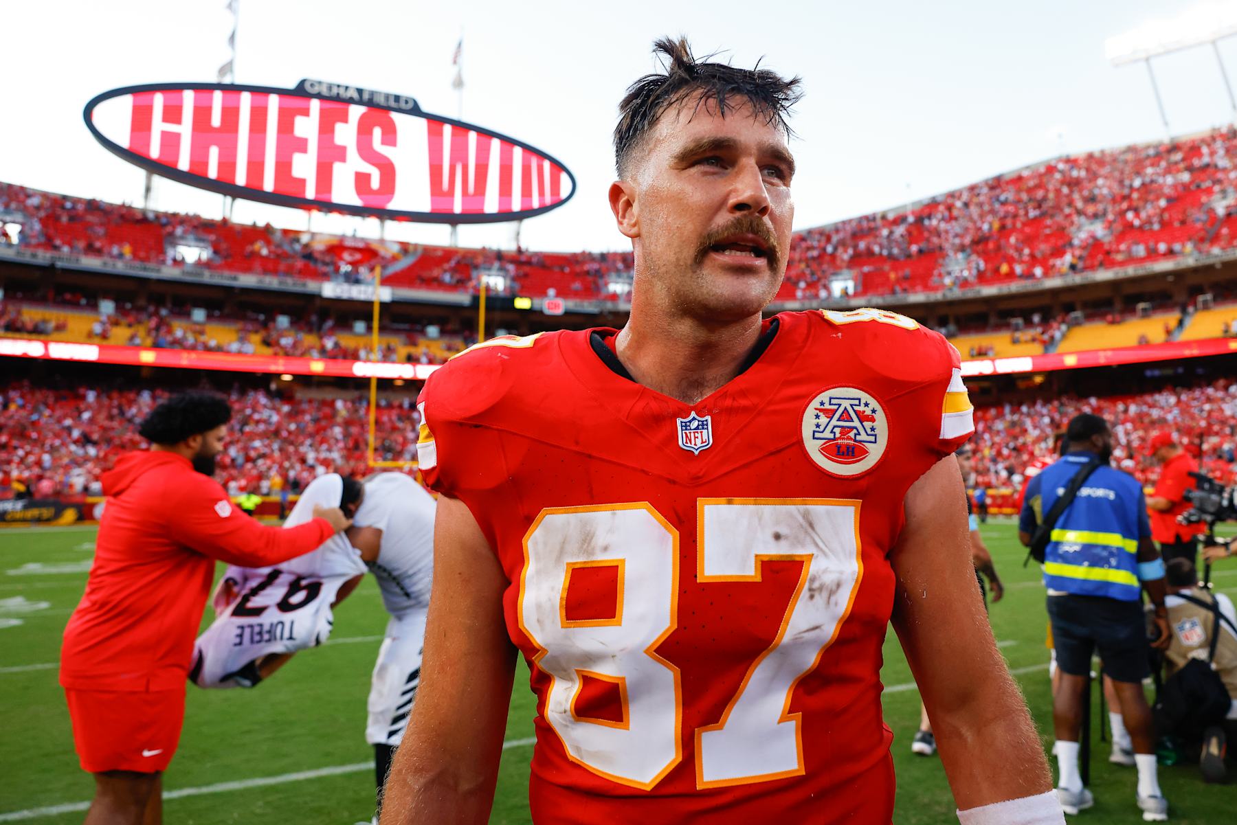 KANSAS CITY, MISSOURI - SEPTEMBER 15: Travis Kelce #87 of the Kansas City Chiefs looks for players from the Cincinnati Bengals following the Chiefs 26-25 win at GEHA Field at Arrowhead Stadium on September 15, 2024 in Kansas City, Missouri. (Photo by David Eulitt/Getty Images)