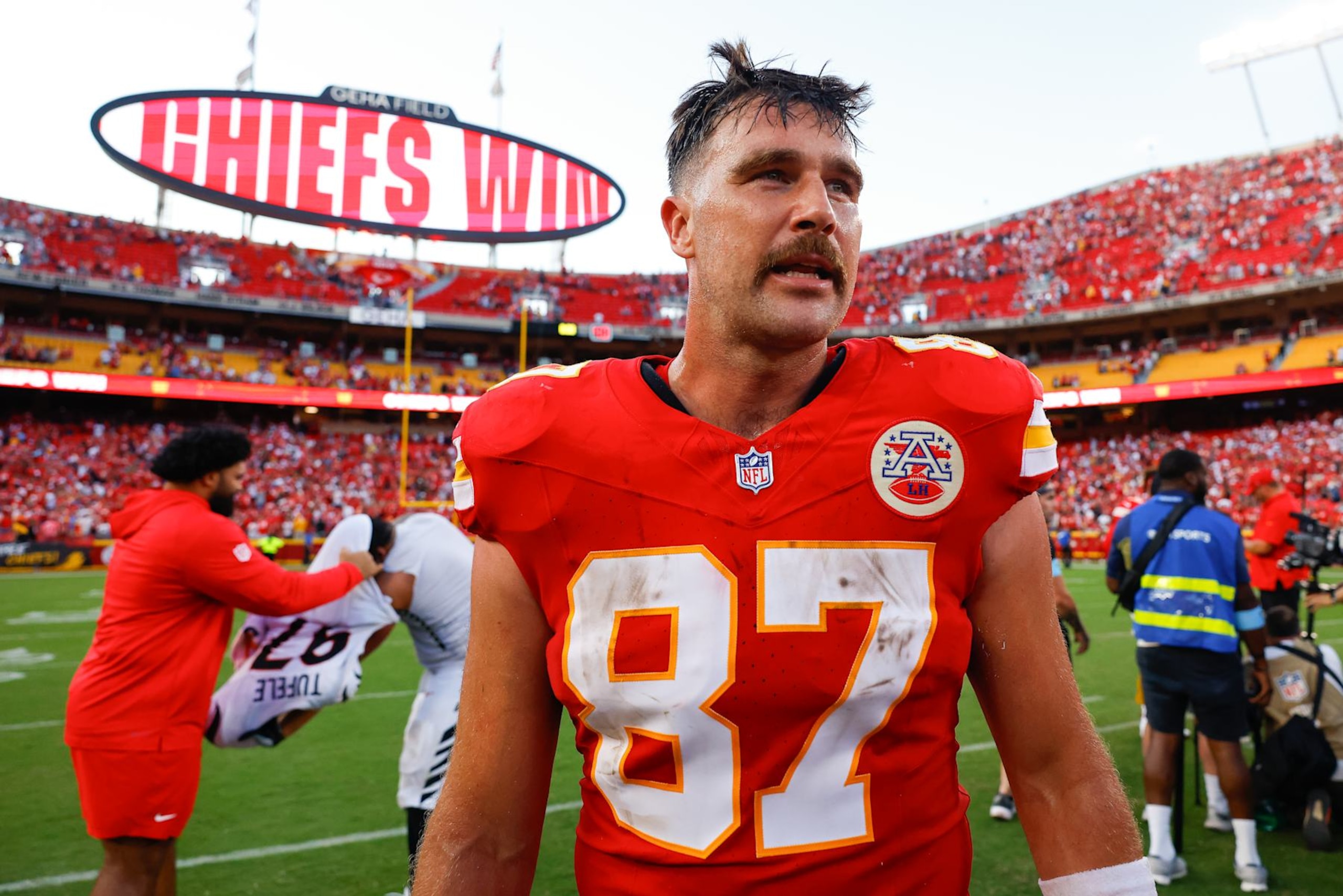 KANSAS CITY, MISSOURI - SEPTEMBER 15: Travis Kelce #87 of the Kansas City Chiefs looks for players from the Cincinnati Bengals following the Chiefs 26-25 win at GEHA Field at Arrowhead Stadium on September 15, 2024 in Kansas City, Missouri. (Photo by David Eulitt/Getty Images)