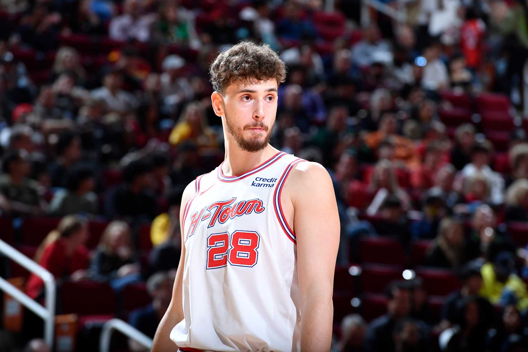 HOUSTON, TX - FEBRUARY 23:   Alperen Sengun #28 of the Houston Rockets looks on during the game against the Phoenix Suns on February 23, 2024 at the Toyota Center in Houston, Texas. NOTE TO USER: User expressly acknowledges and agrees that, by downloading and or using this photograph, User is consenting to the terms and conditions of the Getty Images License Agreement. Mandatory Copyright Notice: Copyright 2024 NBAE (Photo by Logan Riely/NBAE via Getty Images)