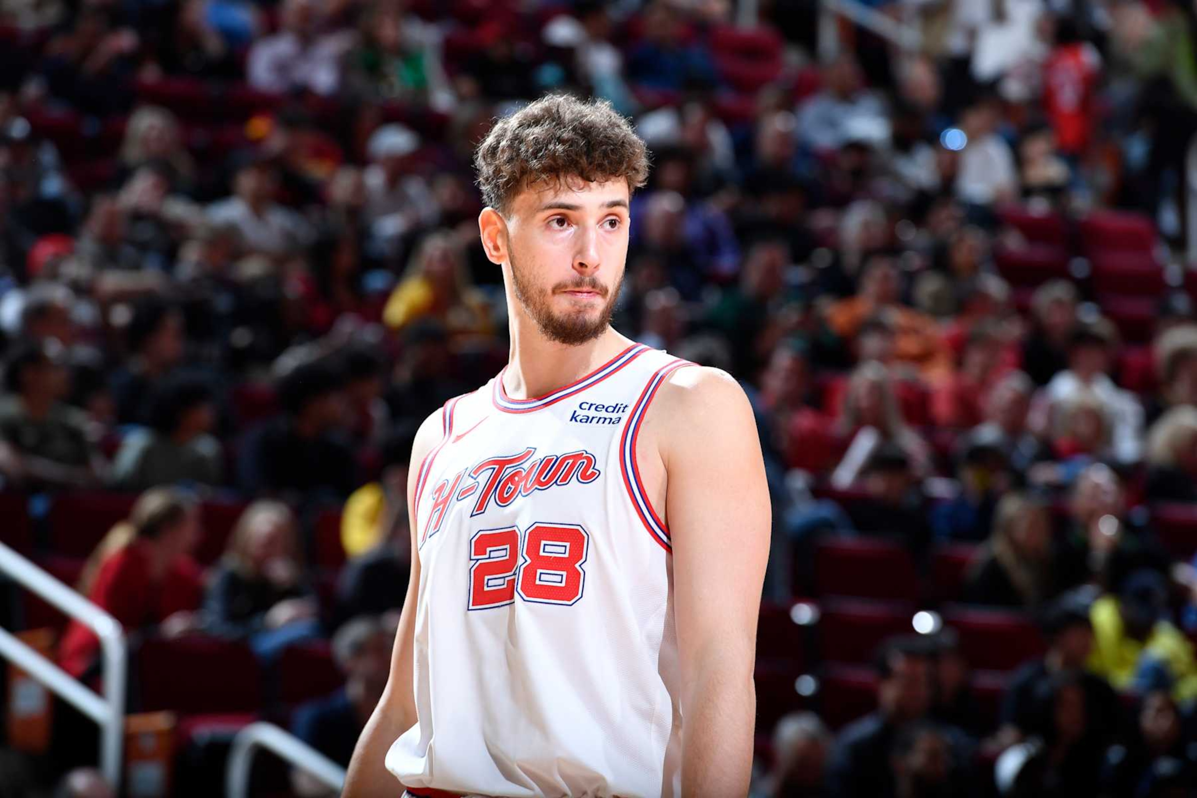 HOUSTON, TX - FEBRUARY 23:   Alperen Sengun #28 of the Houston Rockets looks on during the game against the Phoenix Suns on February 23, 2024 at the Toyota Center in Houston, Texas. NOTE TO USER: User expressly acknowledges and agrees that, by downloading and or using this photograph, User is consenting to the terms and conditions of the Getty Images License Agreement. Mandatory Copyright Notice: Copyright 2024 NBAE (Photo by Logan Riely/NBAE via Getty Images)
