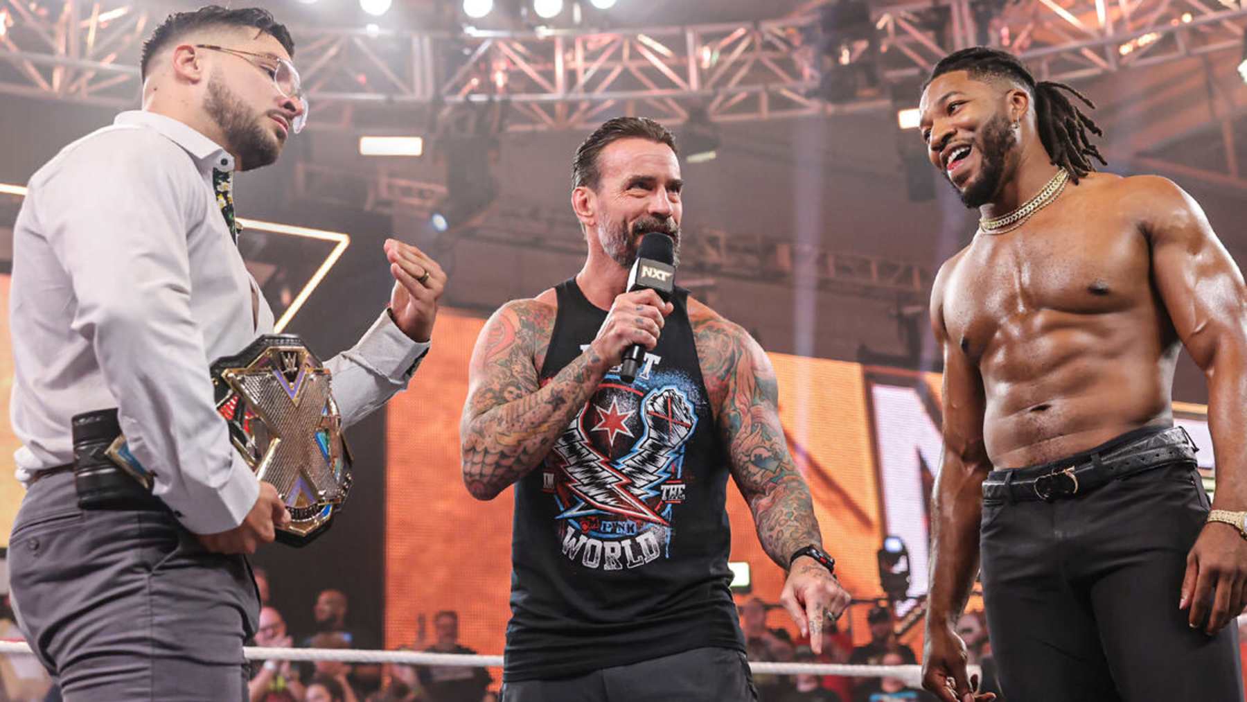 CM Punk stood between Ethan Page and Trick Williams as guest referee in the NXT Championship match.