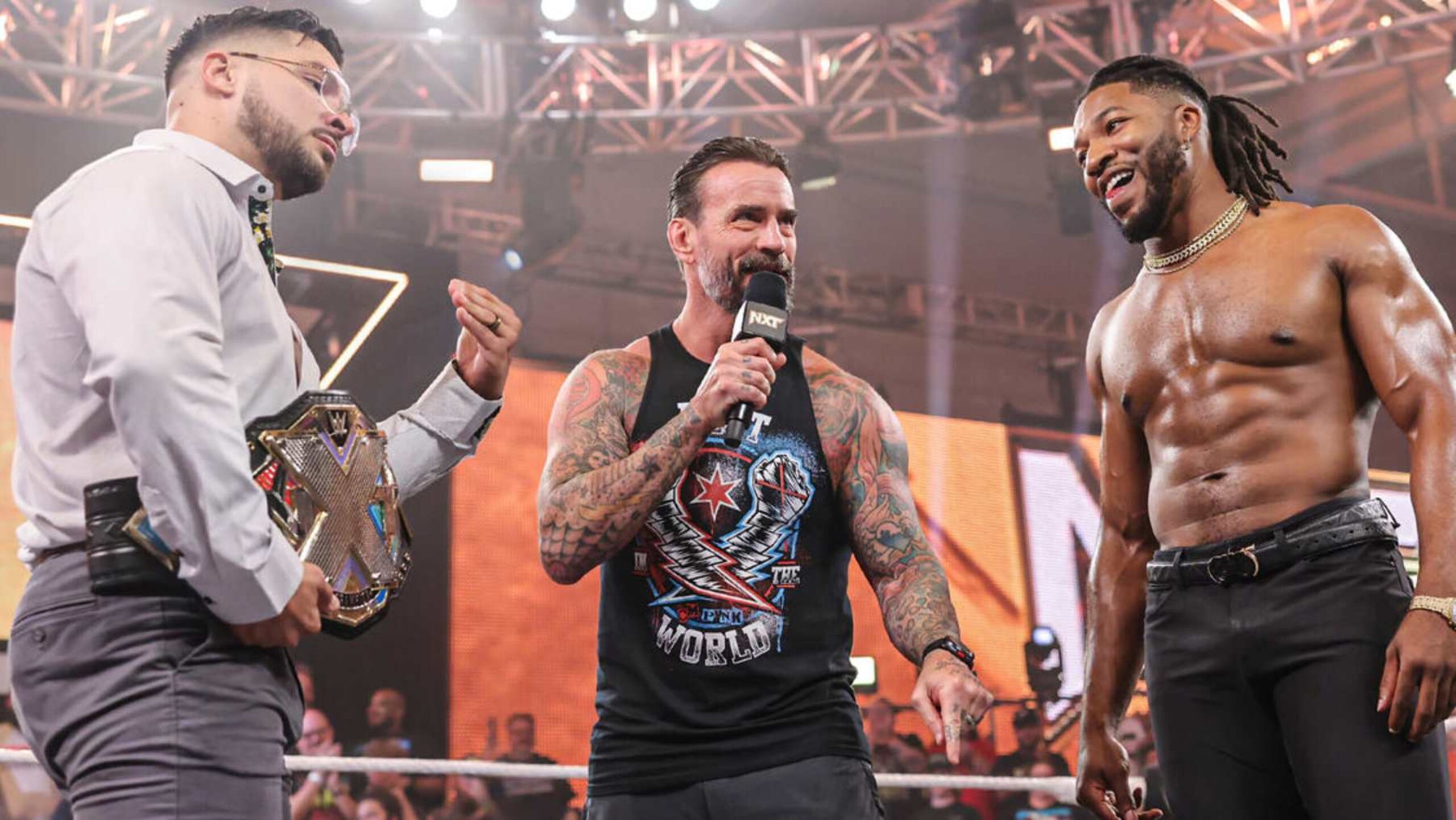 CM Punk stood between Ethan Page and Trick Williams as guest referee in the NXT Championship match.