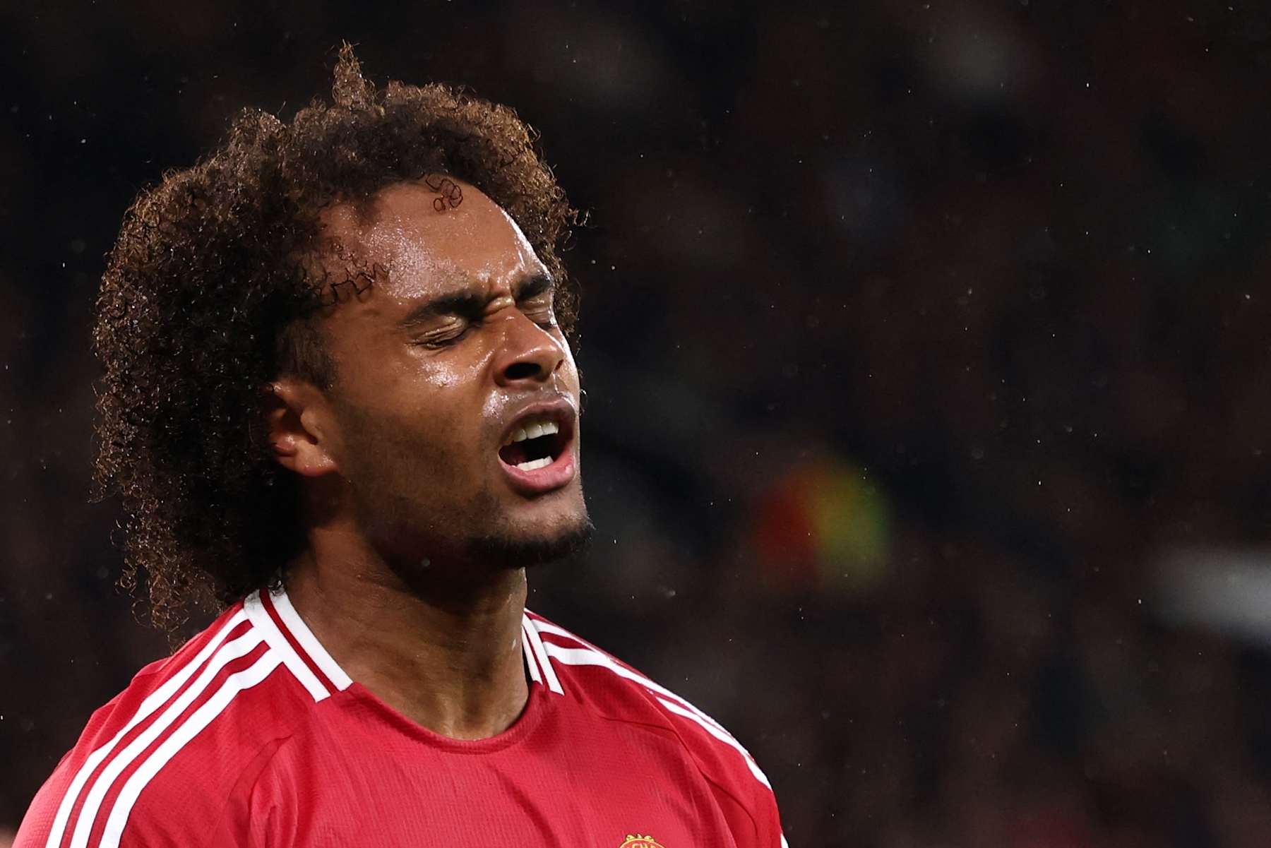 Manchester United's Dutch striker #11 Joshua Zirkzee reacts after missing a chance on goal during the UEFA Europa league stage football match between Manchester United and FC Twente at Old Trafford stadium in Manchester, north west England, on September 25, 2024. (Photo by Darren Staples / AFP) (Photo by DARREN STAPLES/AFP via Getty Images)