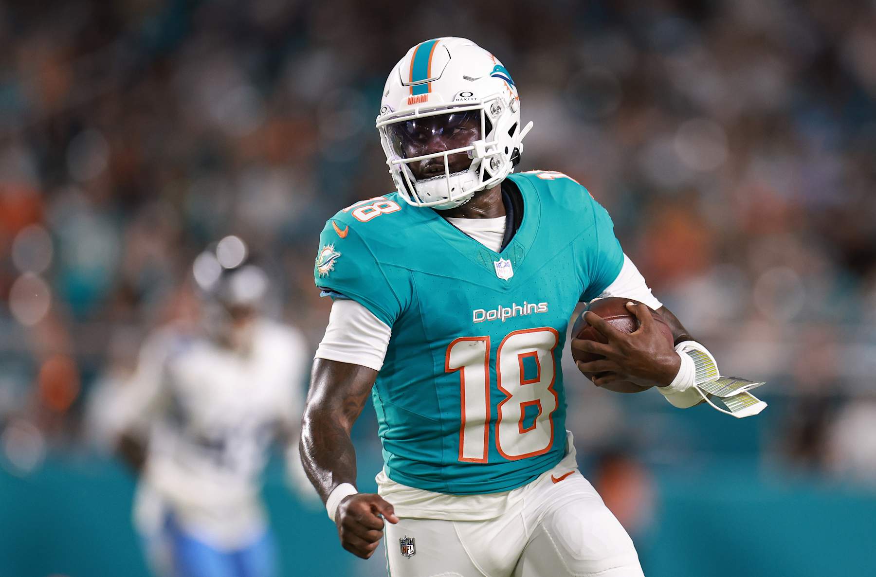 MIAMI GARDENS, FLORIDA - SEPTEMBER 30: Tyler Huntley #18 of the Miami Dolphins runs with the ball during the second quarter at Hard Rock Stadium on September 30, 2024 in Miami Gardens, Florida. (Photo by Carmen Mandato/Getty Images)