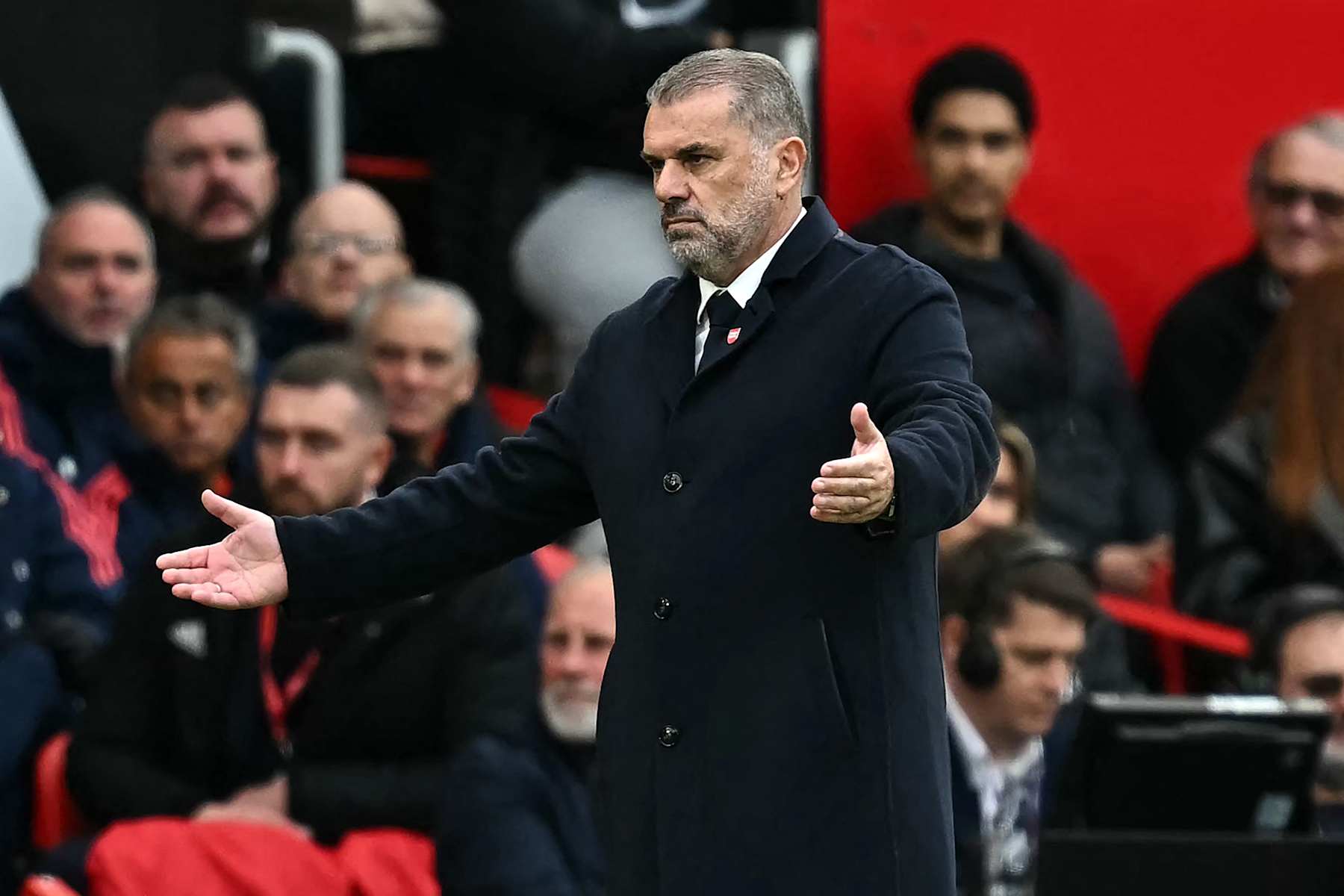 Tottenham Hotspur's Greek-Australian Head Coach Ange Postecoglou reacts on the touchline during the English Premier League football match between Manchester United and Tottenham Hotspur at Old Trafford in Manchester, north west England, on September 29, 2024. (Photo by Paul ELLIS / AFP) / RESTRICTED TO EDITORIAL USE. No use with unauthorized audio, video, data, fixture lists, club/league logos or 'live' services. Online in-match use limited to 120 images. An additional 40 images may be used in extra time. No video emulation. Social media in-match use limited to 120 images. An additional 40 images may be used in extra time. No use in betting publications, games or single club/league/player publications. / (Photo by PAUL ELLIS/AFP via Getty Images)